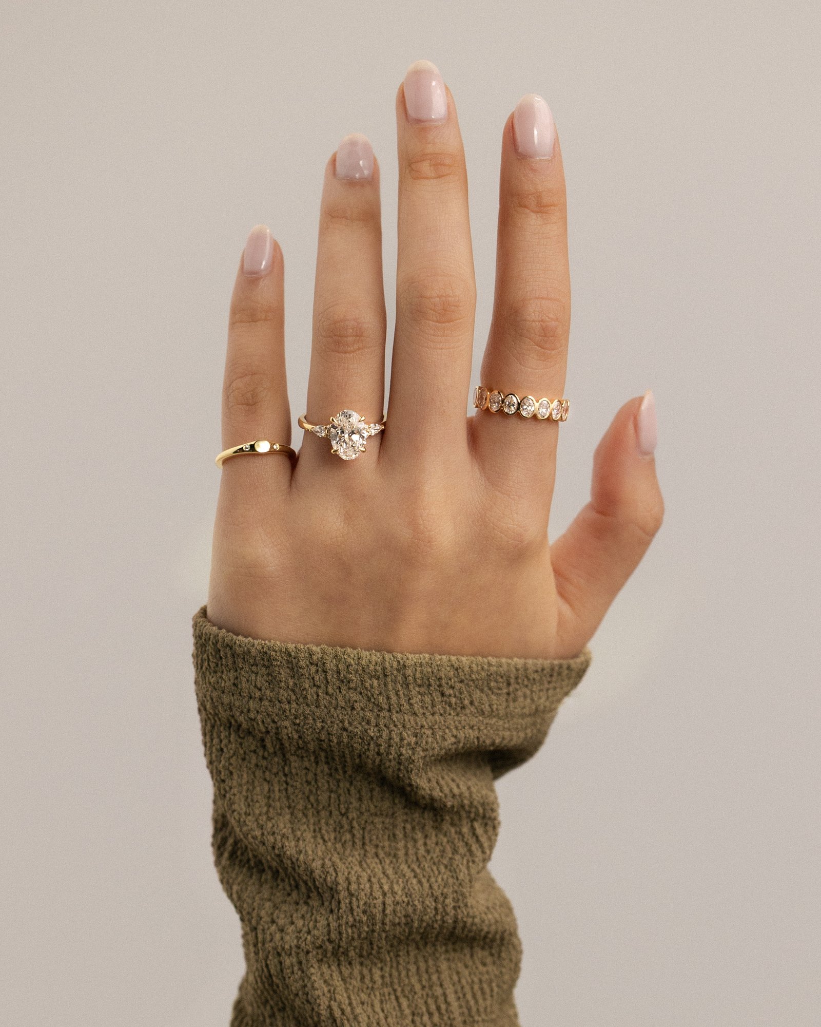 Sheridan  Oval Trilogy with Round and Pear Stones Lifestyle Image