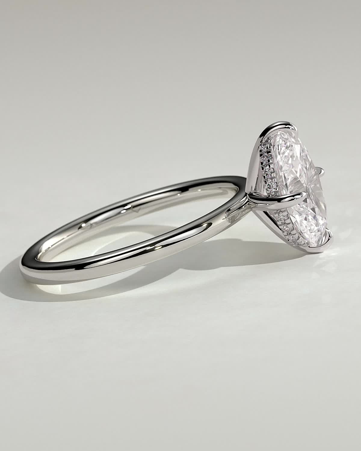 Spencer - Oval 4 Claw Solitaire with Hidden Halo and Compass Rotation  Engagement Ring - 18k White Gold High Setting