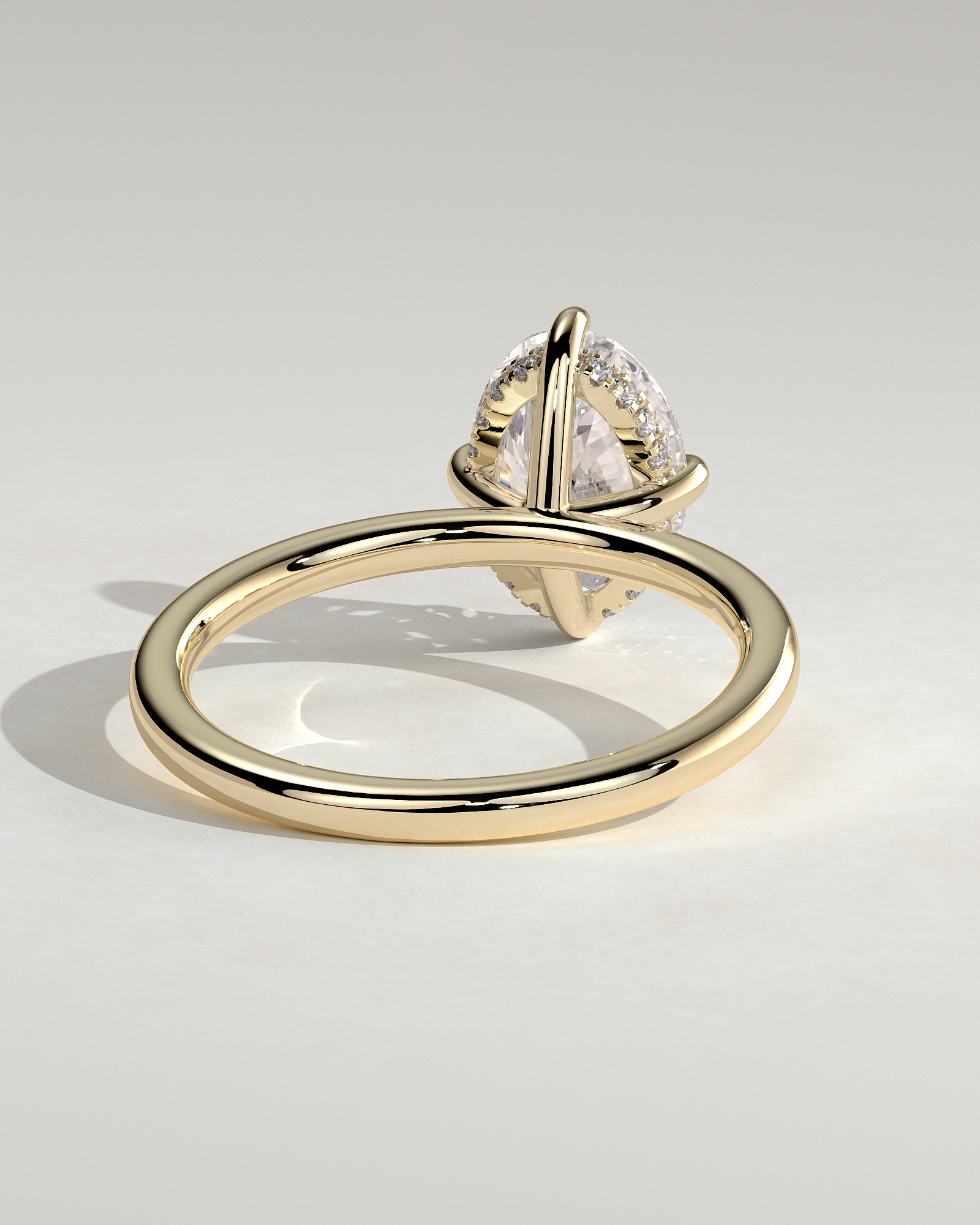 Spencer - Oval 4 Claw Solitaire with Hidden Halo and Compass Rotation  Engagement Ring - 18k Yellow Gold High Setting