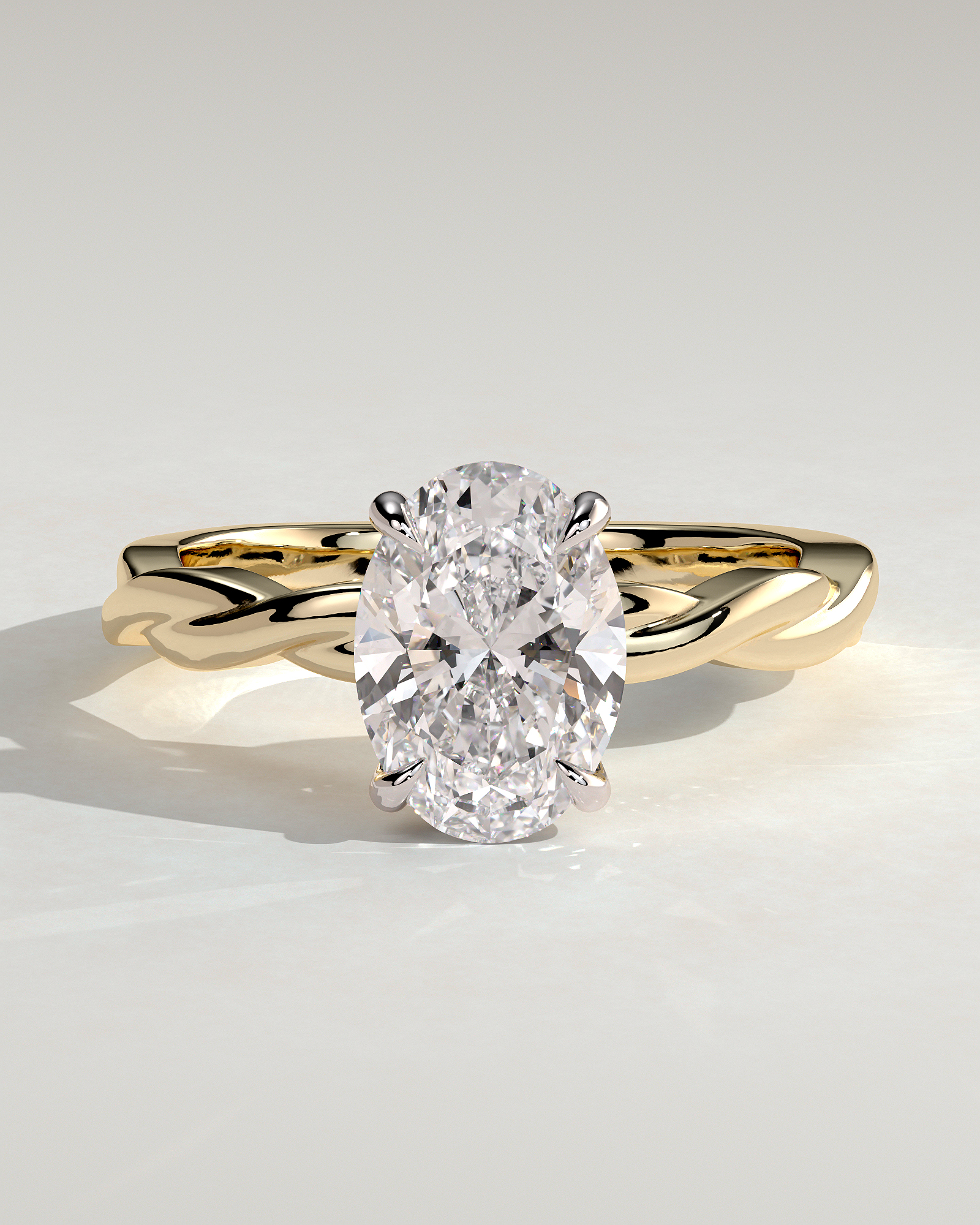 Trinity - Oval 4 Claw Solitaire with Twisted Band Engagement Ring - 18k Yellow Gold / 18k White Gold