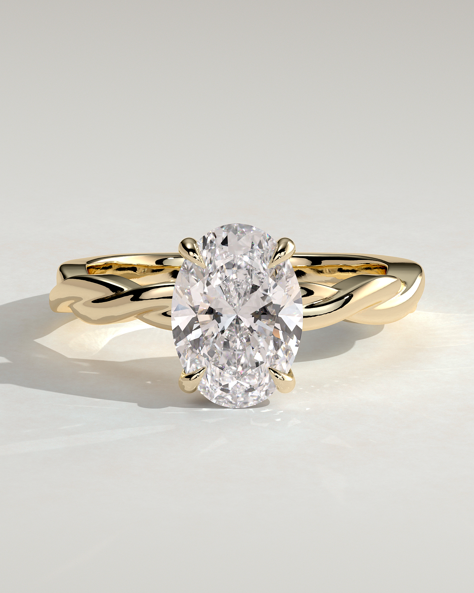 Trinity - Oval 4 Claw Solitaire with Twisted Band Engagement Ring - 18k Yellow Gold