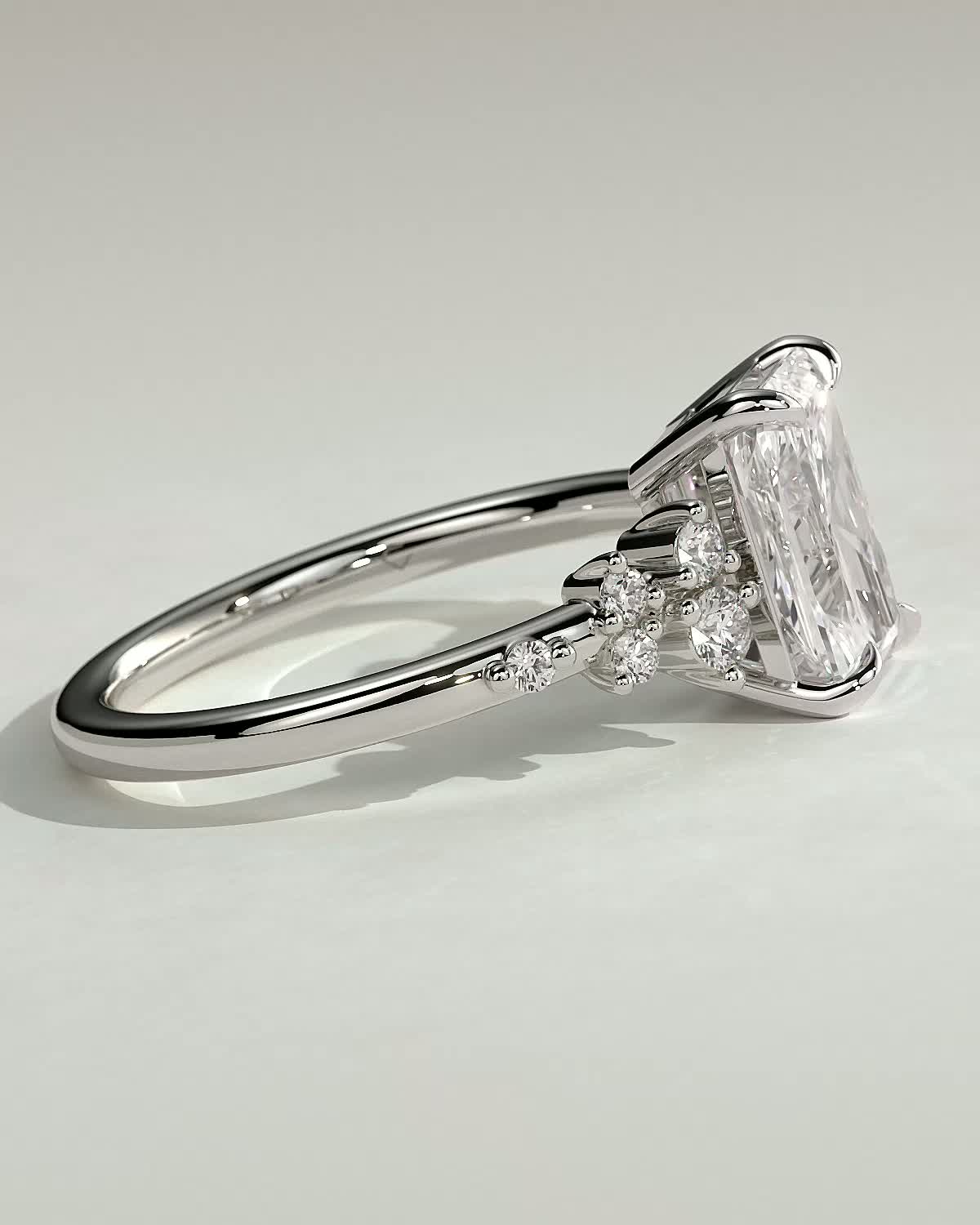 Radiant 4 Claw Solitaire with Clustered Round Shoulder Stones Engagement Ring - 18k White Gold