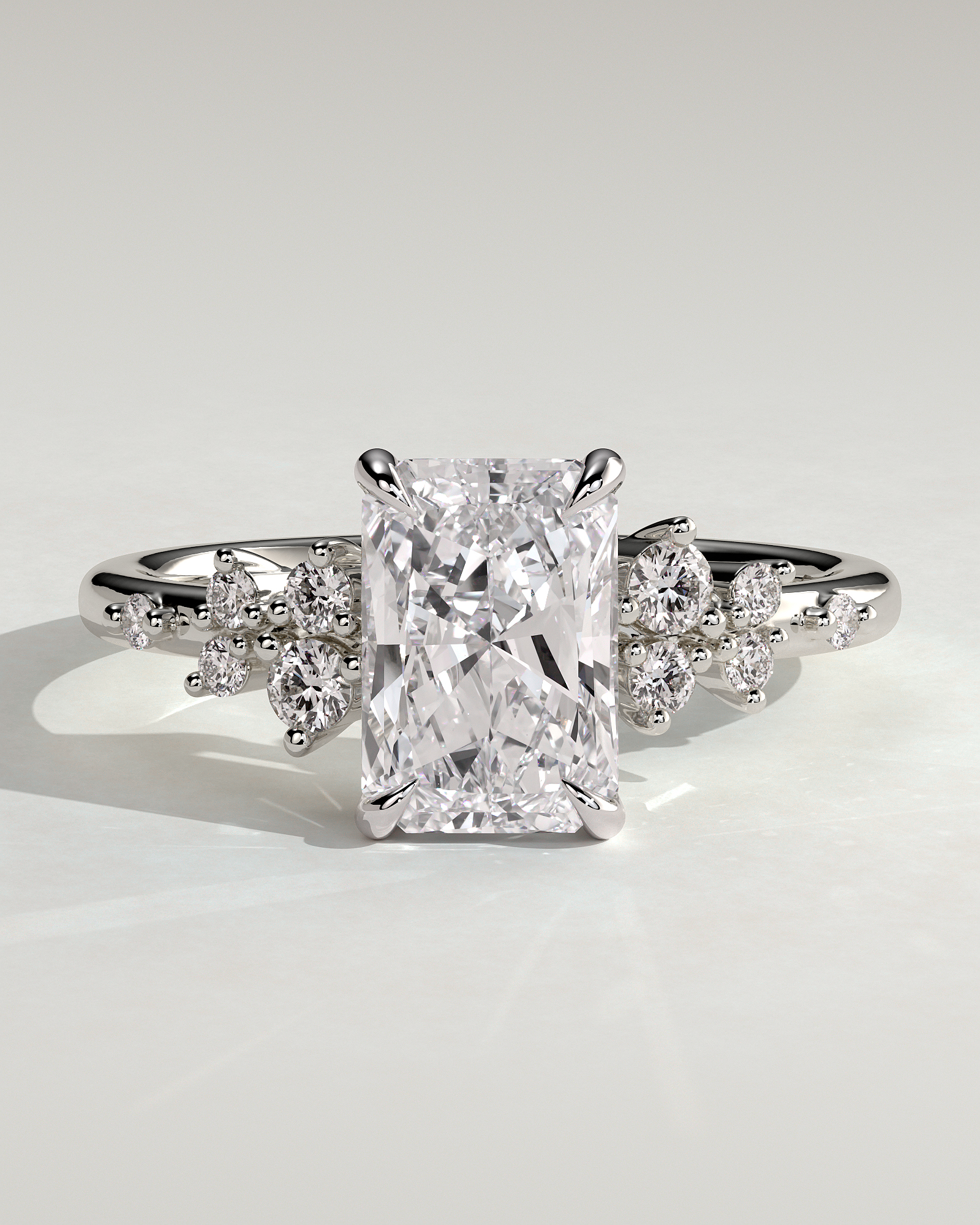 Radiant 4 Claw Solitaire with Clustered Round Shoulder Stones Engagement Ring - 18k White Gold