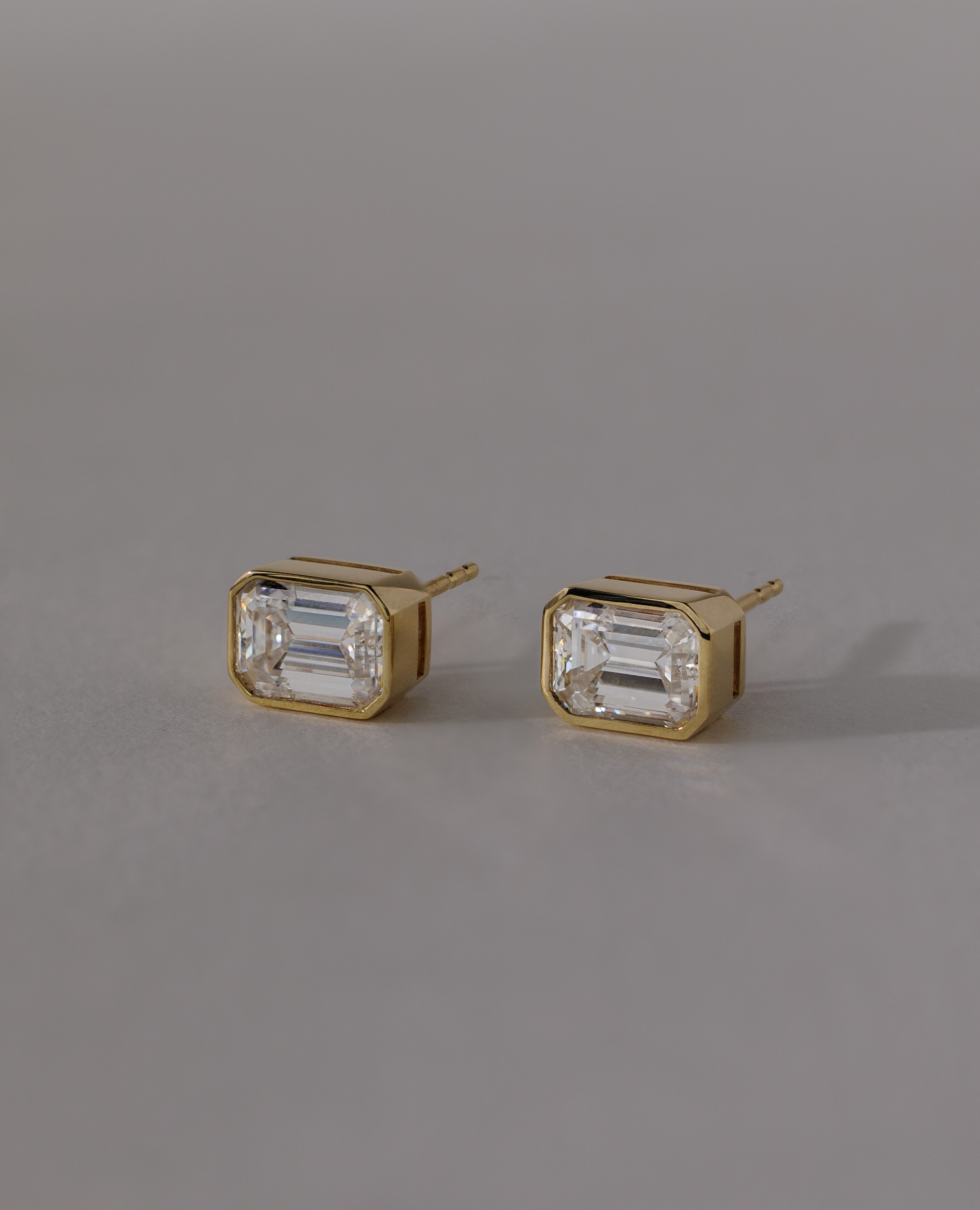 Kara - Emerald Bezel Earrings Lifestyle Image