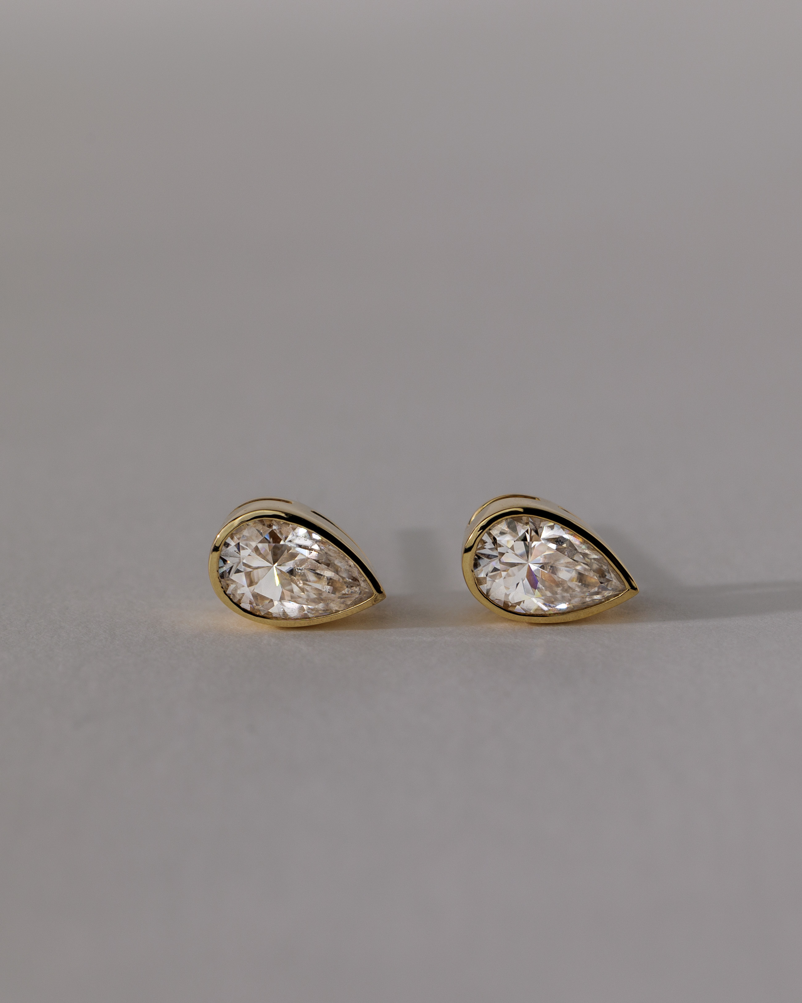 Lucia - Pear Bezel Earrings Lifestyle Image