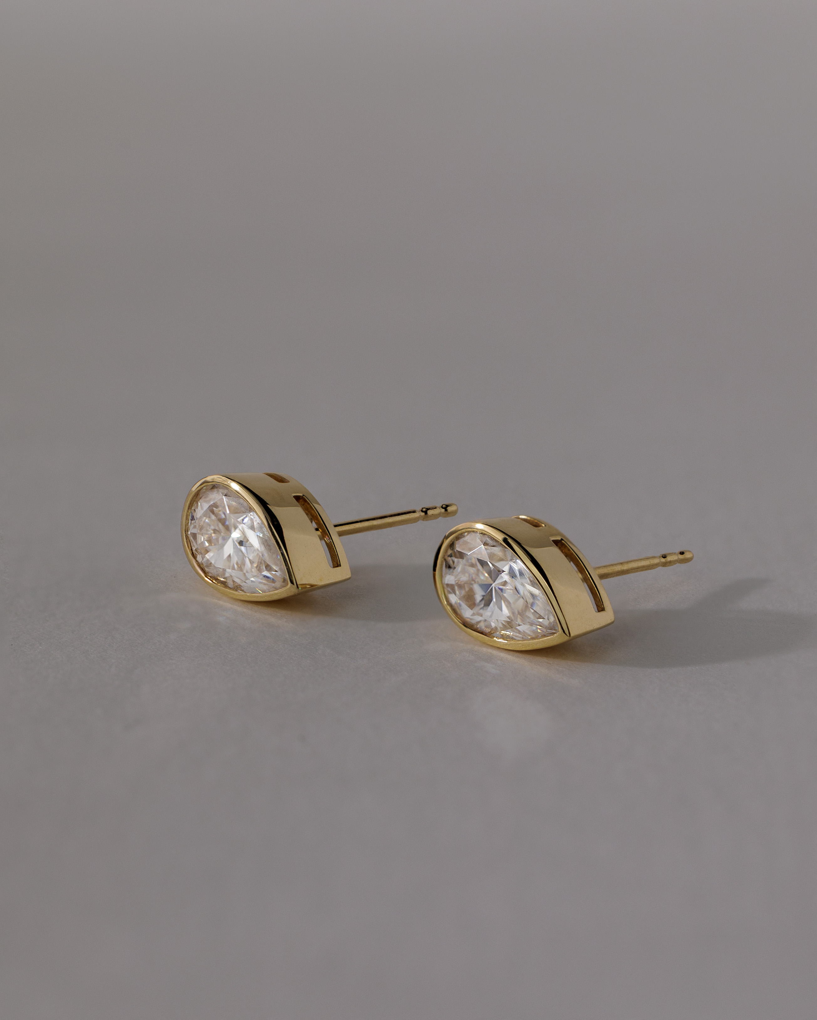 Lucia - Pear Bezel Earrings Lifestyle Image
