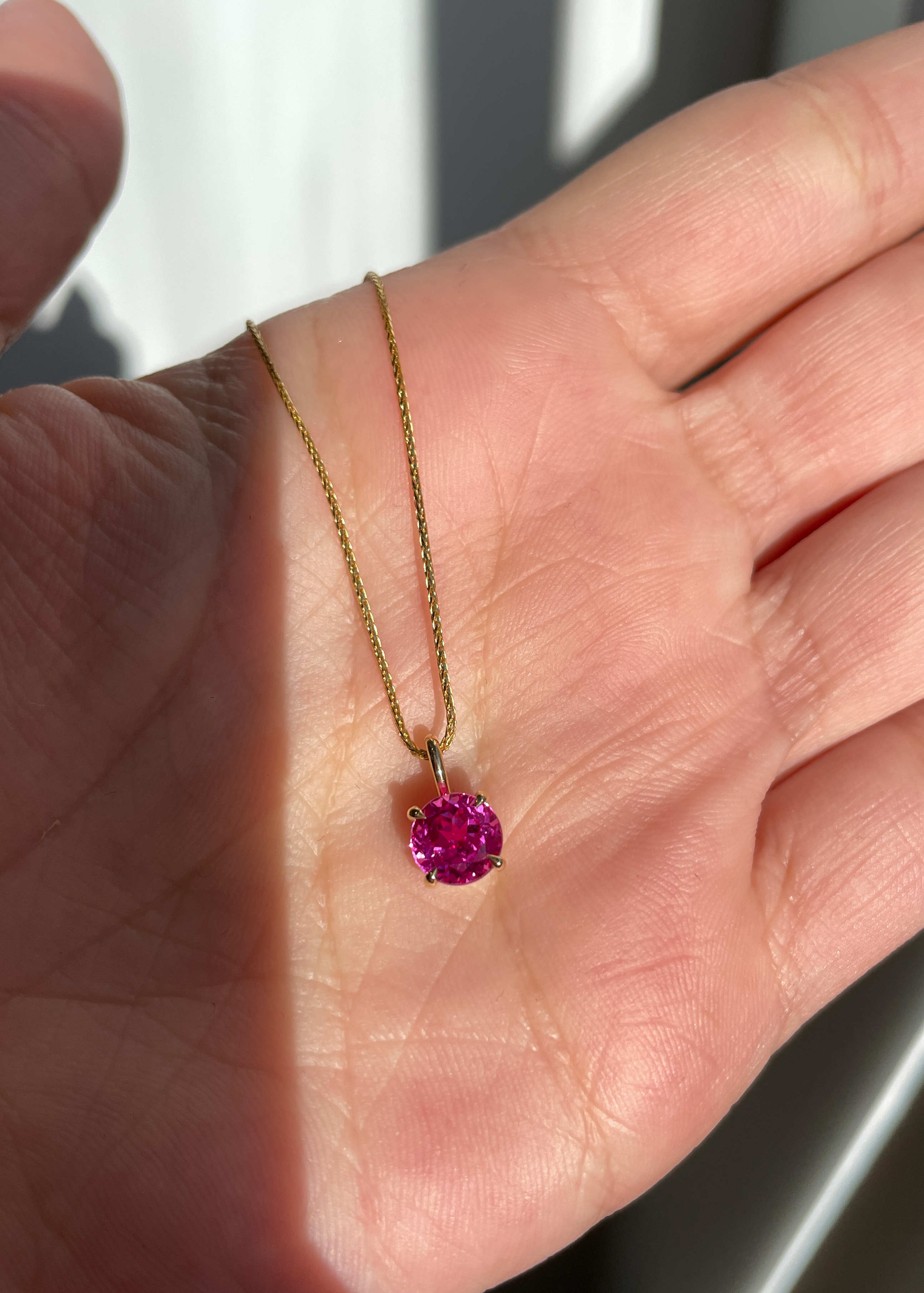 Alicia  Round Pink Sapphire Pendant Lifestyle Image