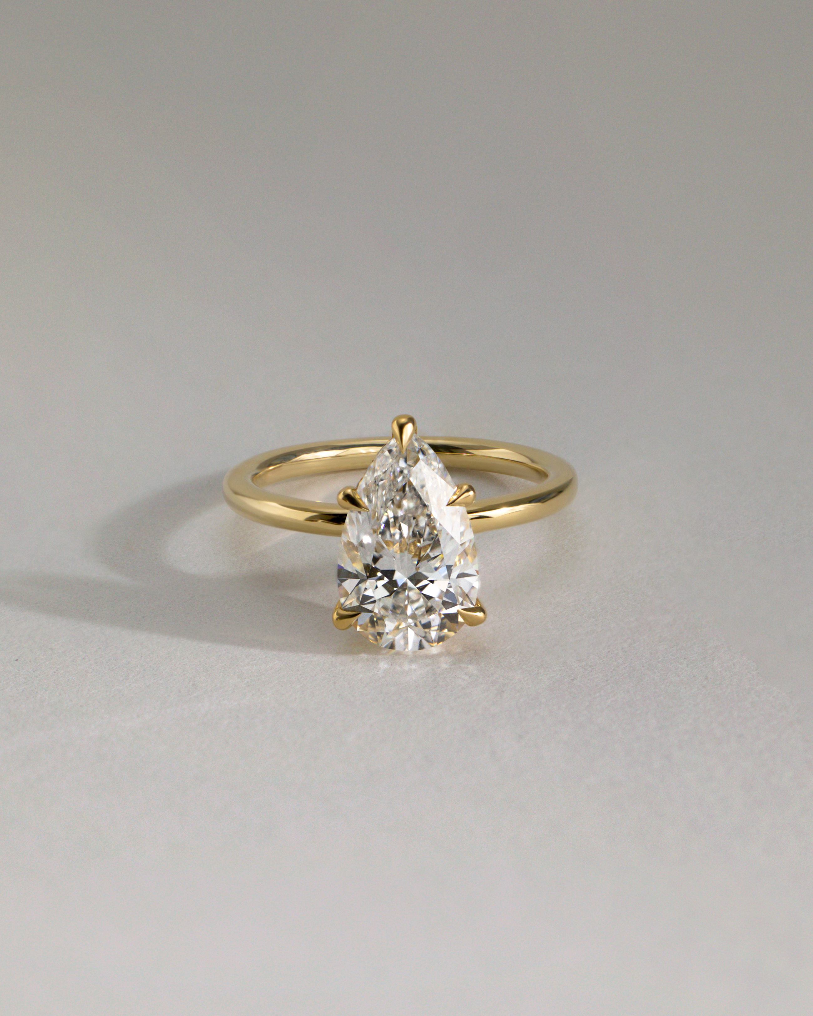 Ainsley - 5 Claw Pear Solitaire with Hidden Halo Lifestyle Image