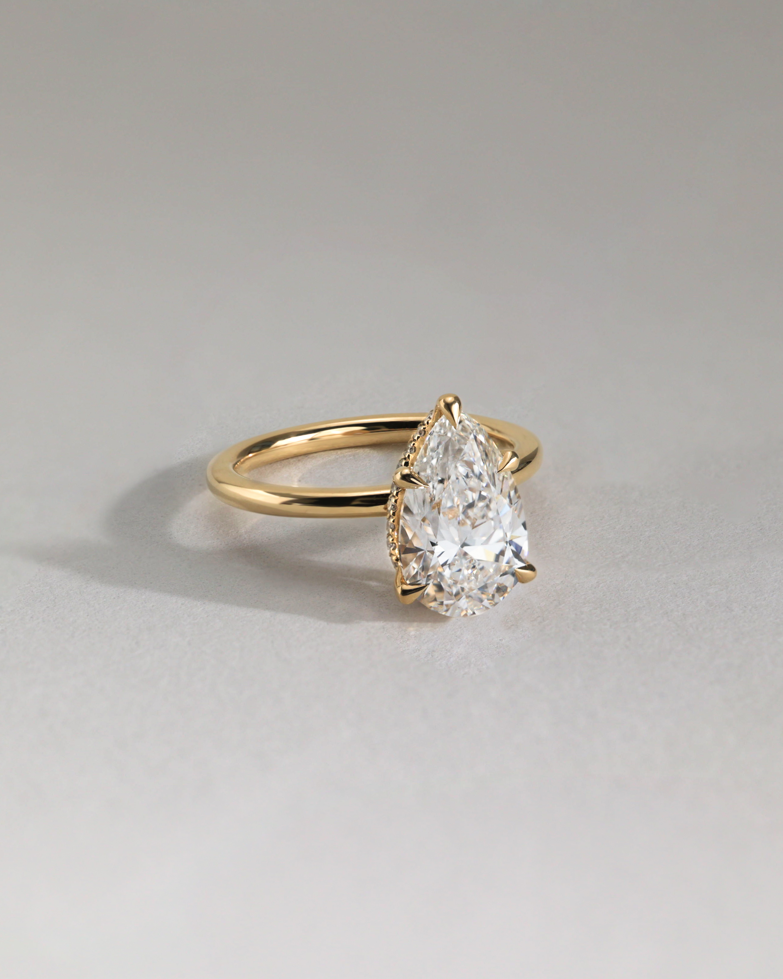 Ainsley - 5 Claw Pear Solitaire with Hidden Halo Lifestyle Image