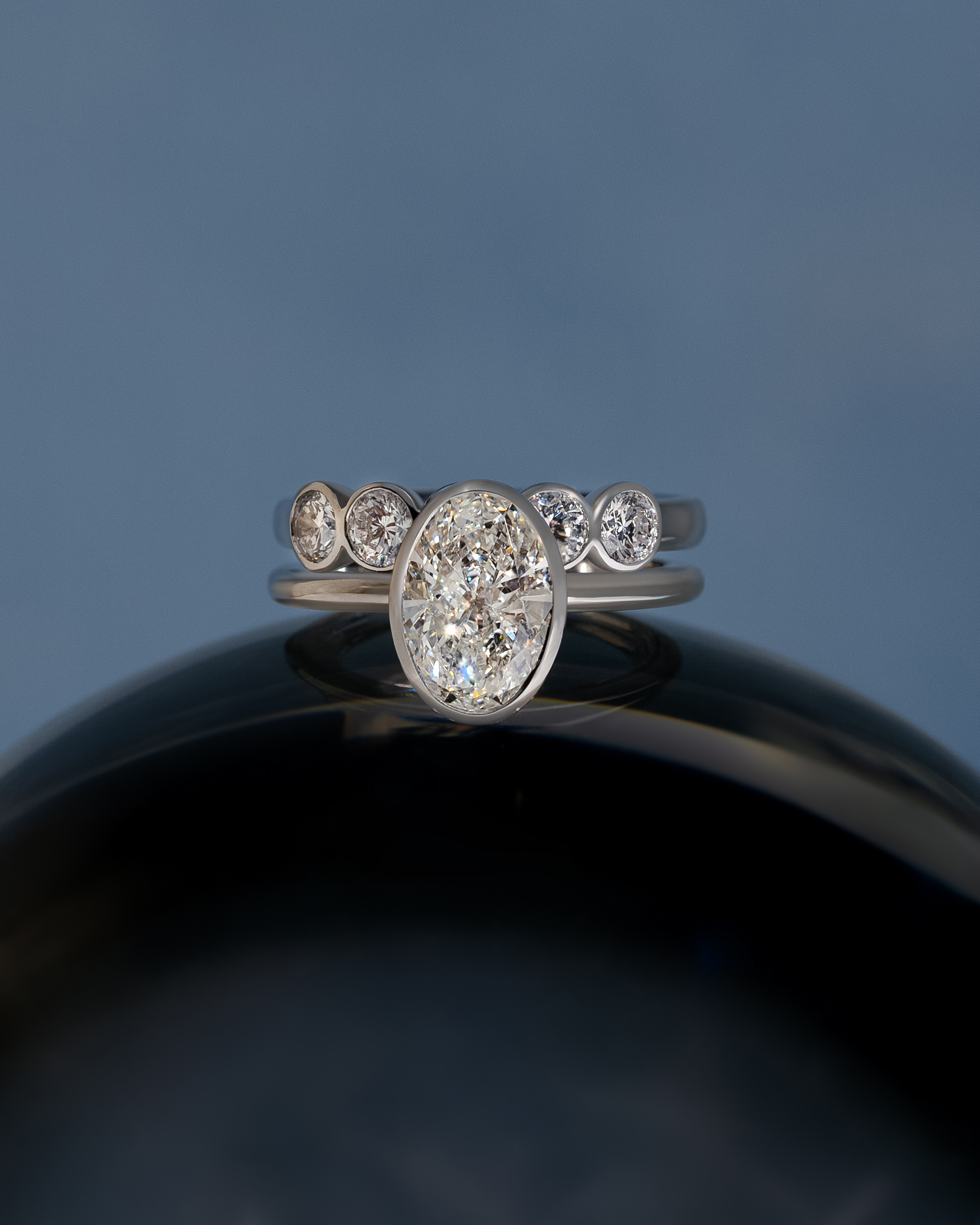 Amber - Bezel Set Round Wedding Ring Lifestyle Image