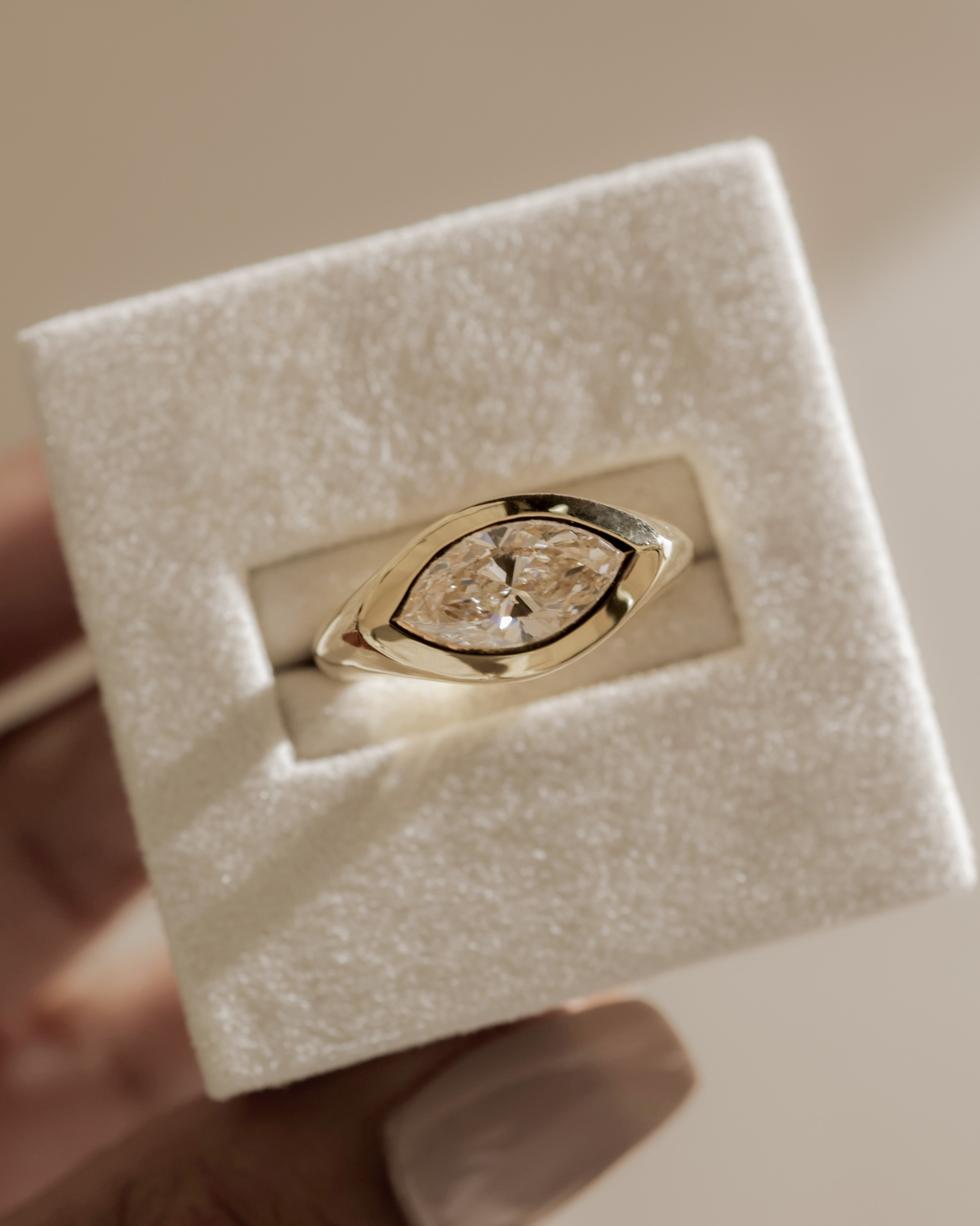 Angie - Marquise East West Bezel Solitaire Lifestyle Image