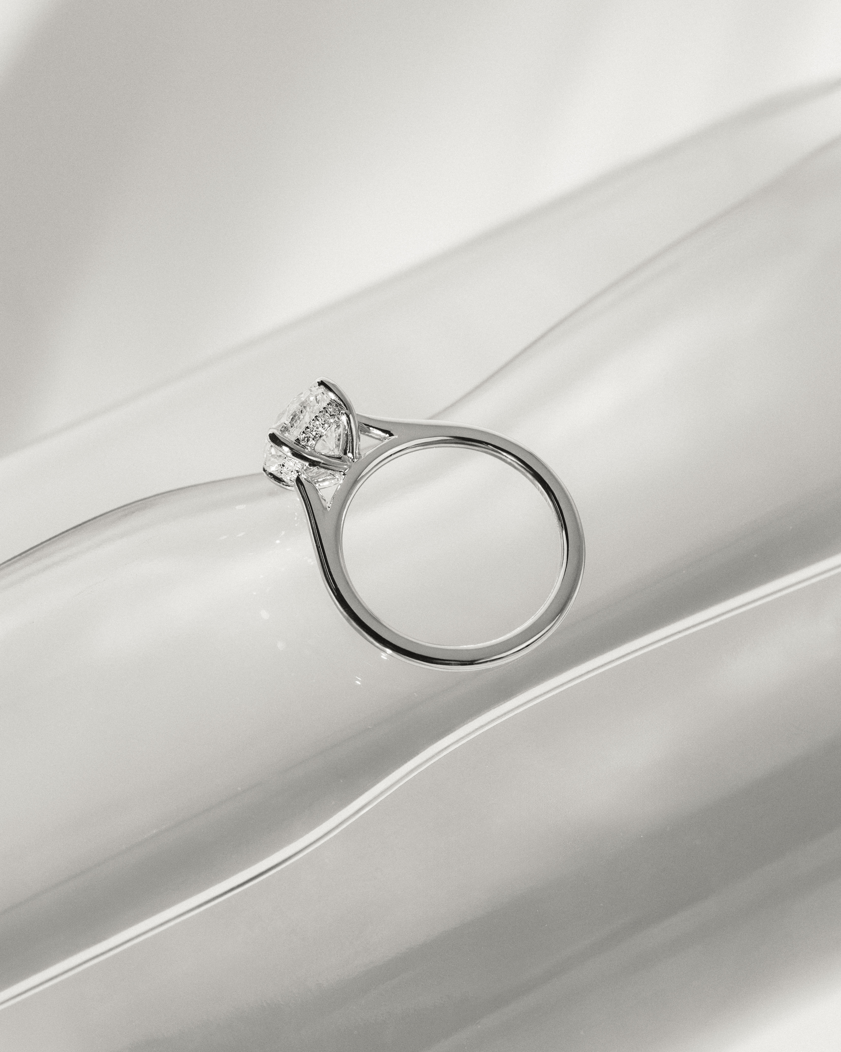 Bonnie  4 Claw Round Solitaire with Hidden Halo Lifestyle Image