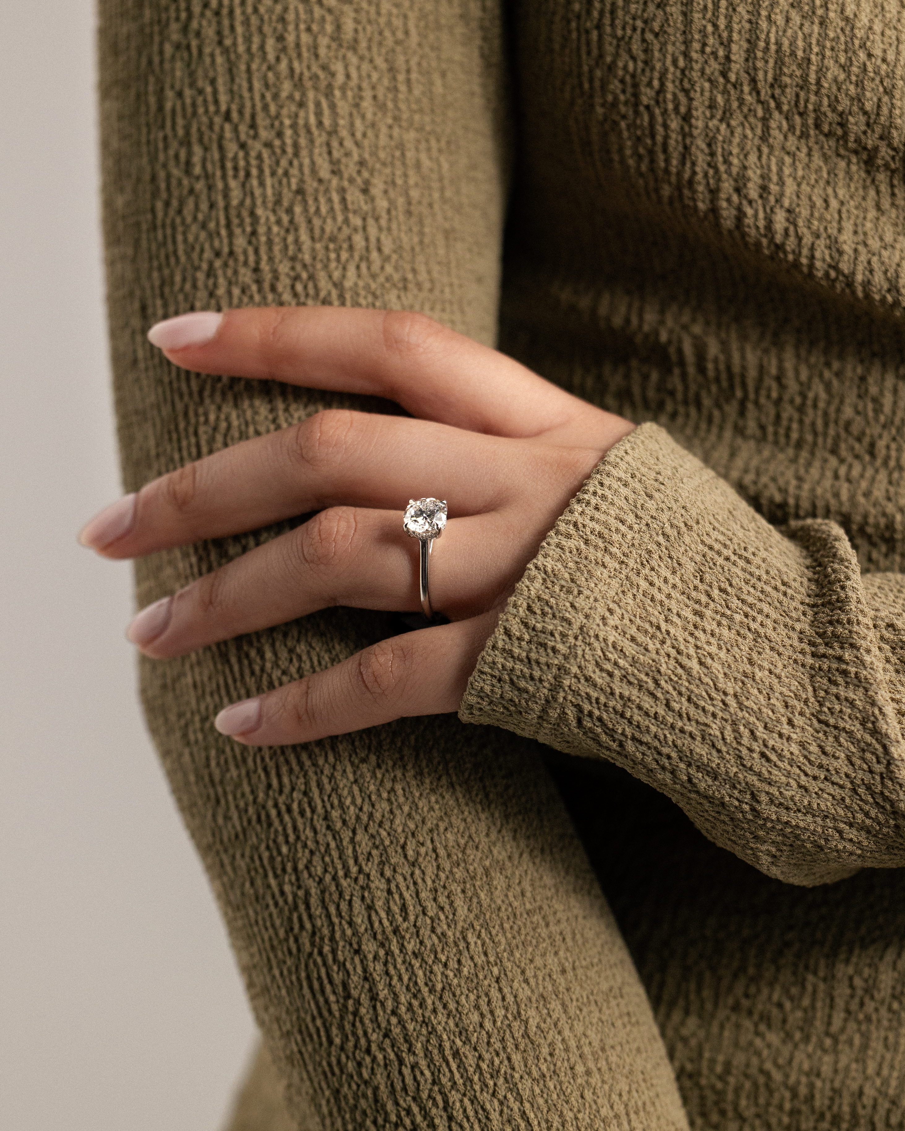 Bonnie  4 Claw Round Solitaire with Hidden Halo Lifestyle Image