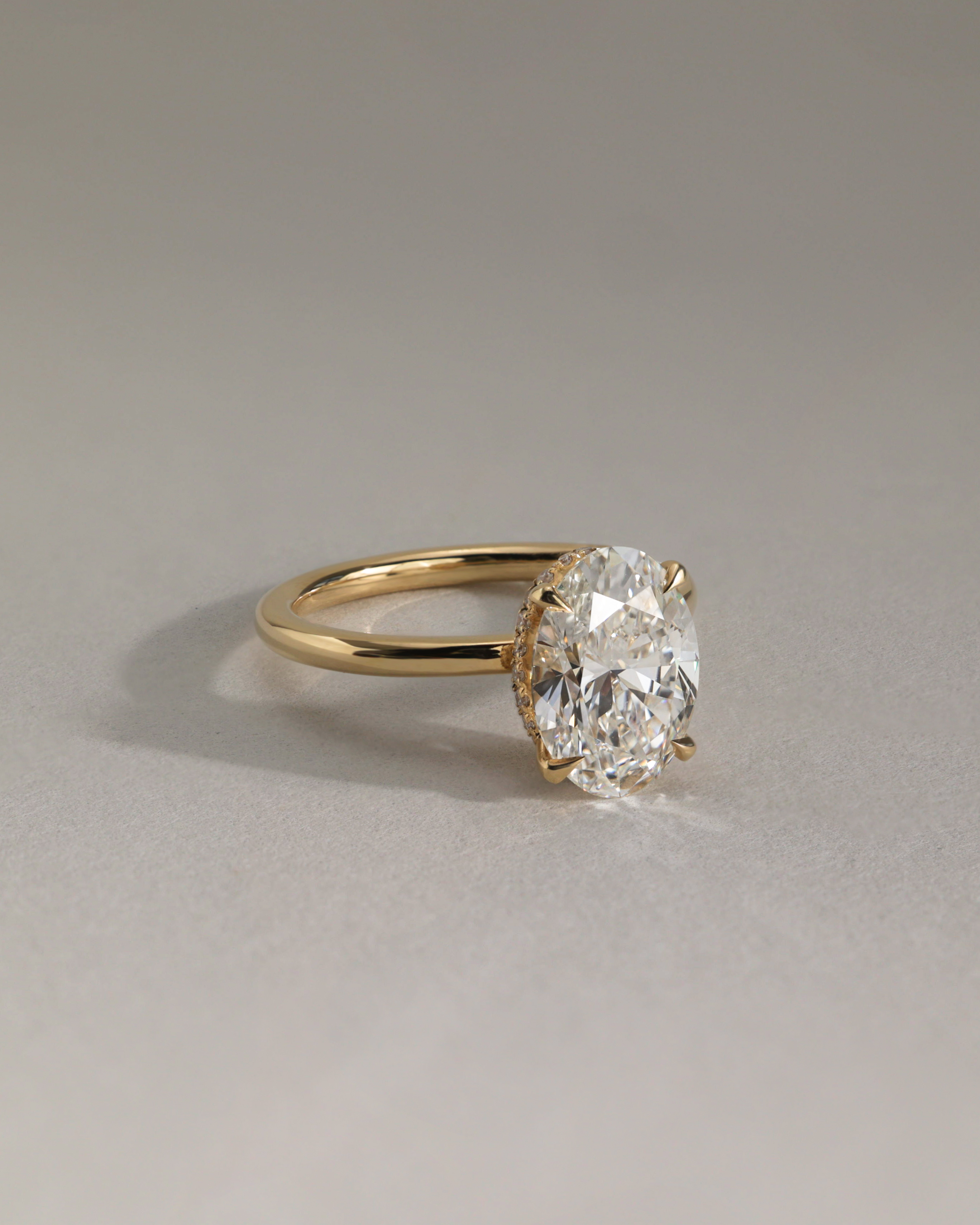 Cecilia - Oval Solitaire with Wrap Around Hidden Halo Lifestyle Image