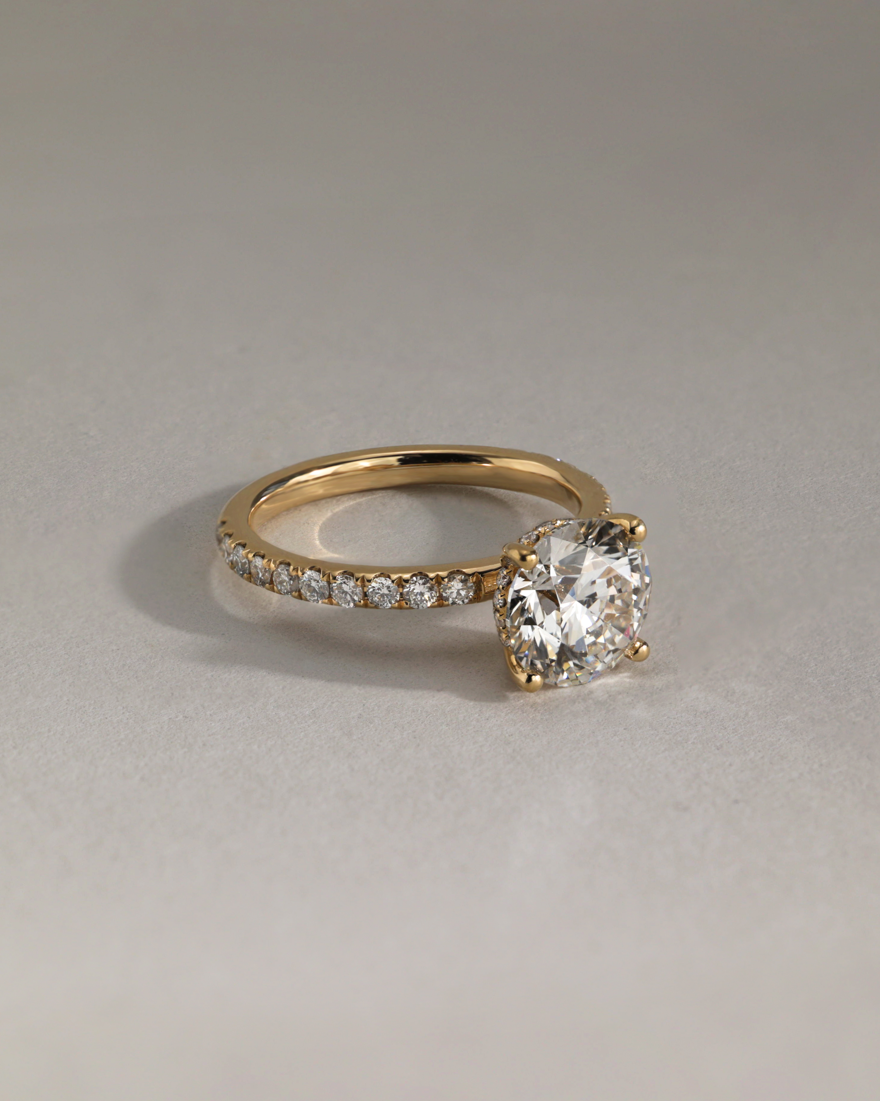 Charlie - 4 Claw Pav Round Solitaire with Hidden Halo Lifestyle Image