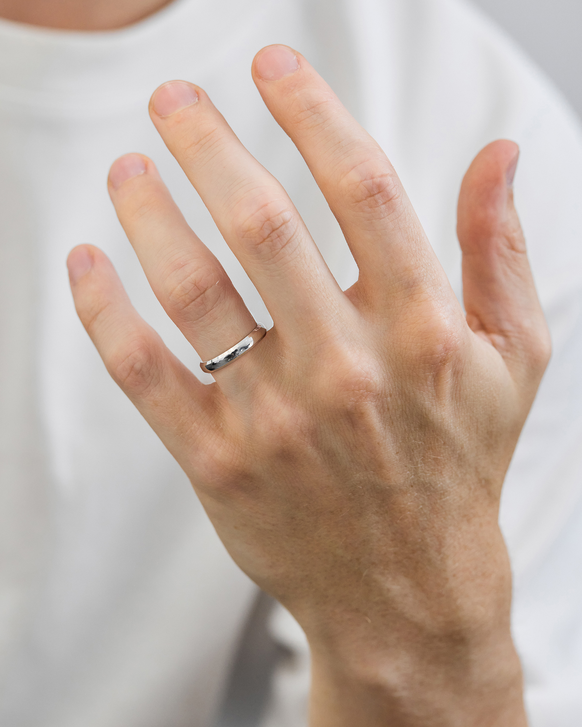 Classic Round Bevel Mens Wedding Ring Lifestyle Image