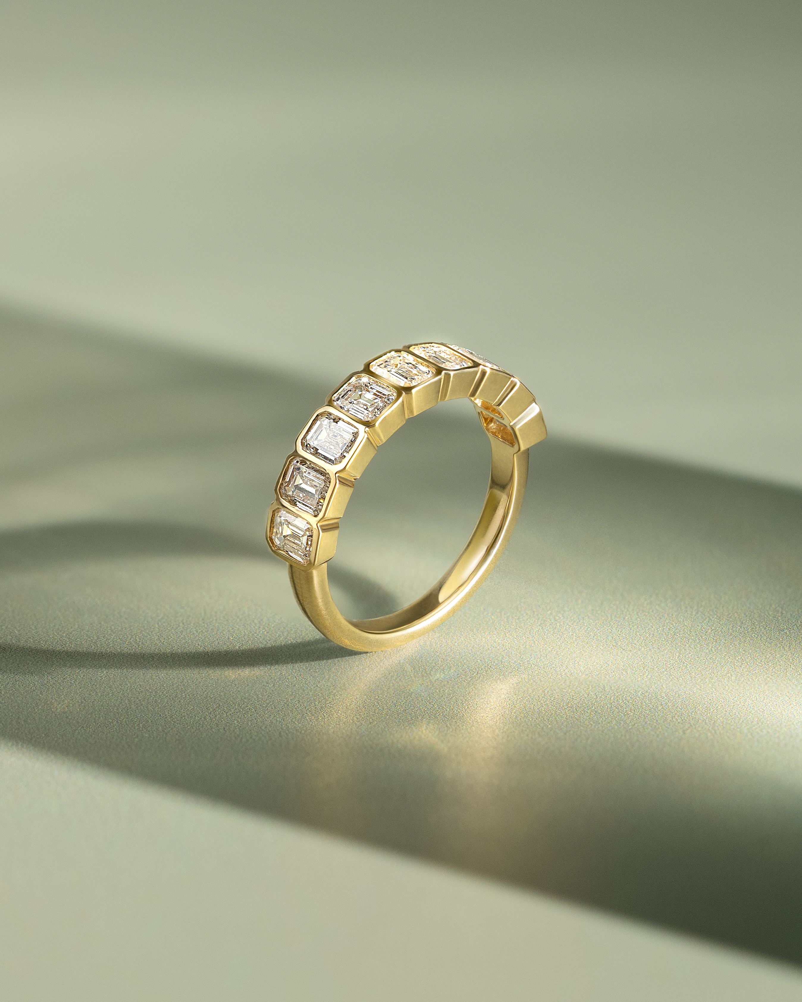 Dallas - Bezel Set Emerald Wedding Ring Lifestyle Image