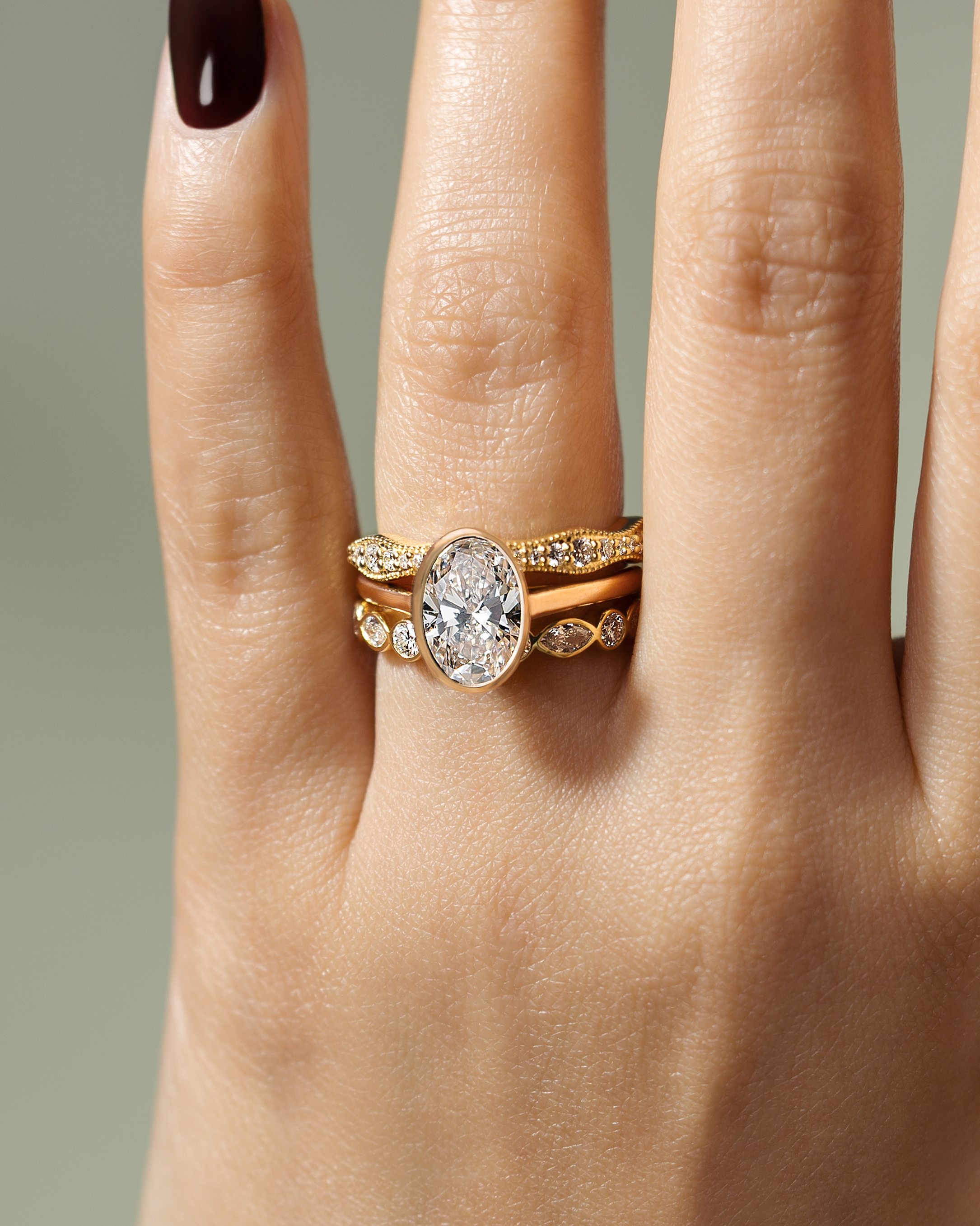 Daphne - Oval Solitaire with Cathedral Bezel Setting Lifestyle Image