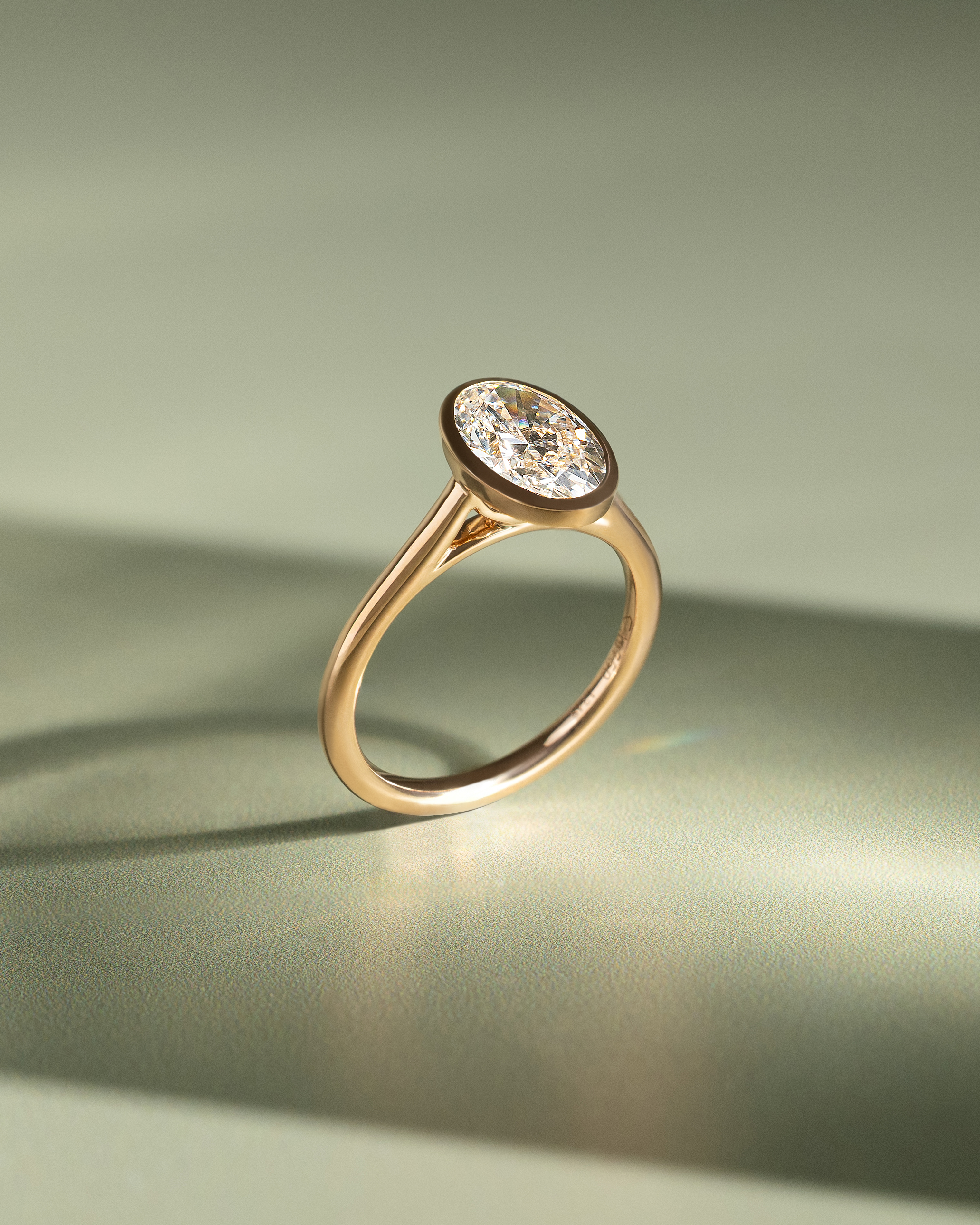 Daphne - Oval Solitaire with Cathedral Bezel Setting Lifestyle Image