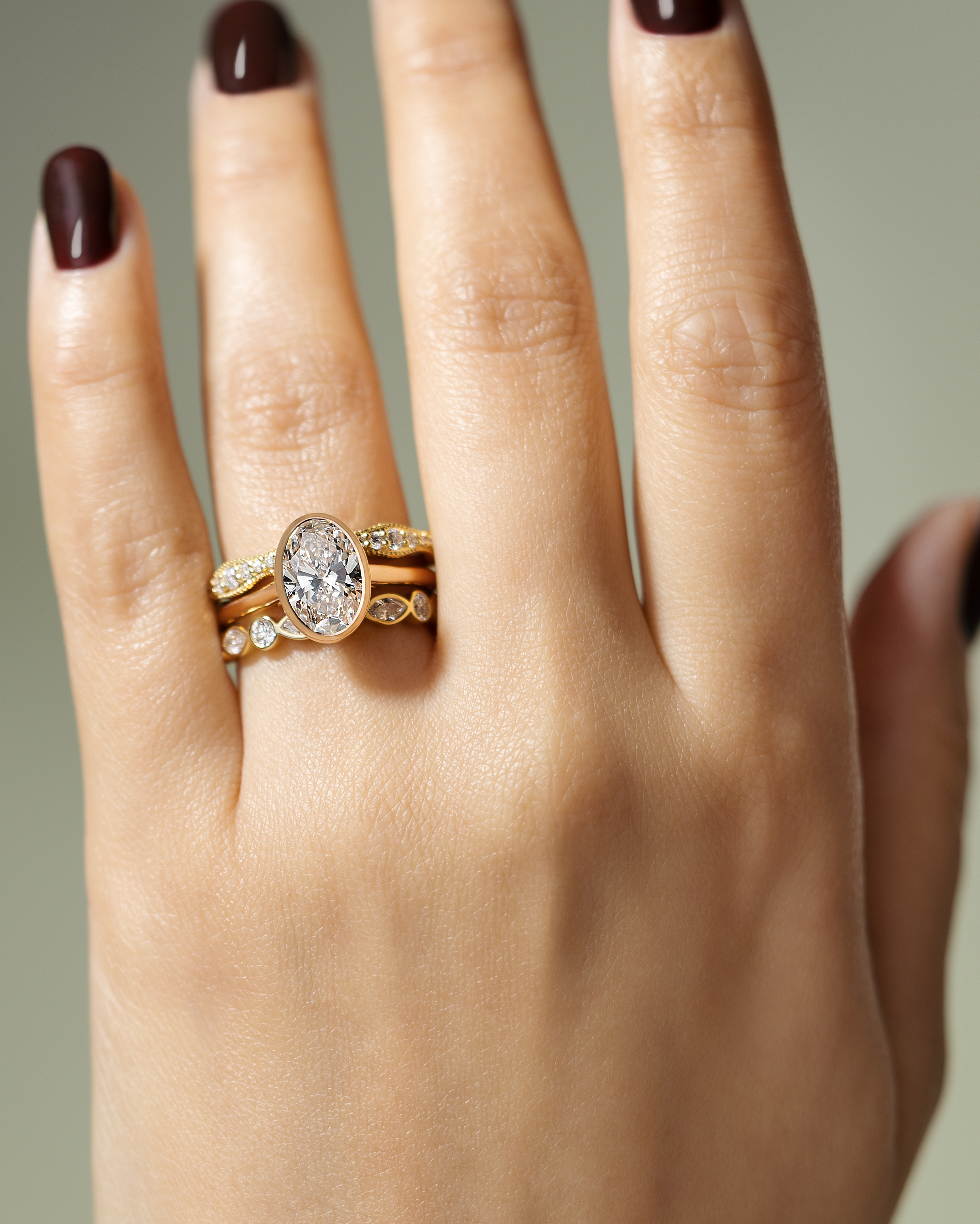 Daphne - Oval Solitaire with Cathedral Bezel Setting Lifestyle Image