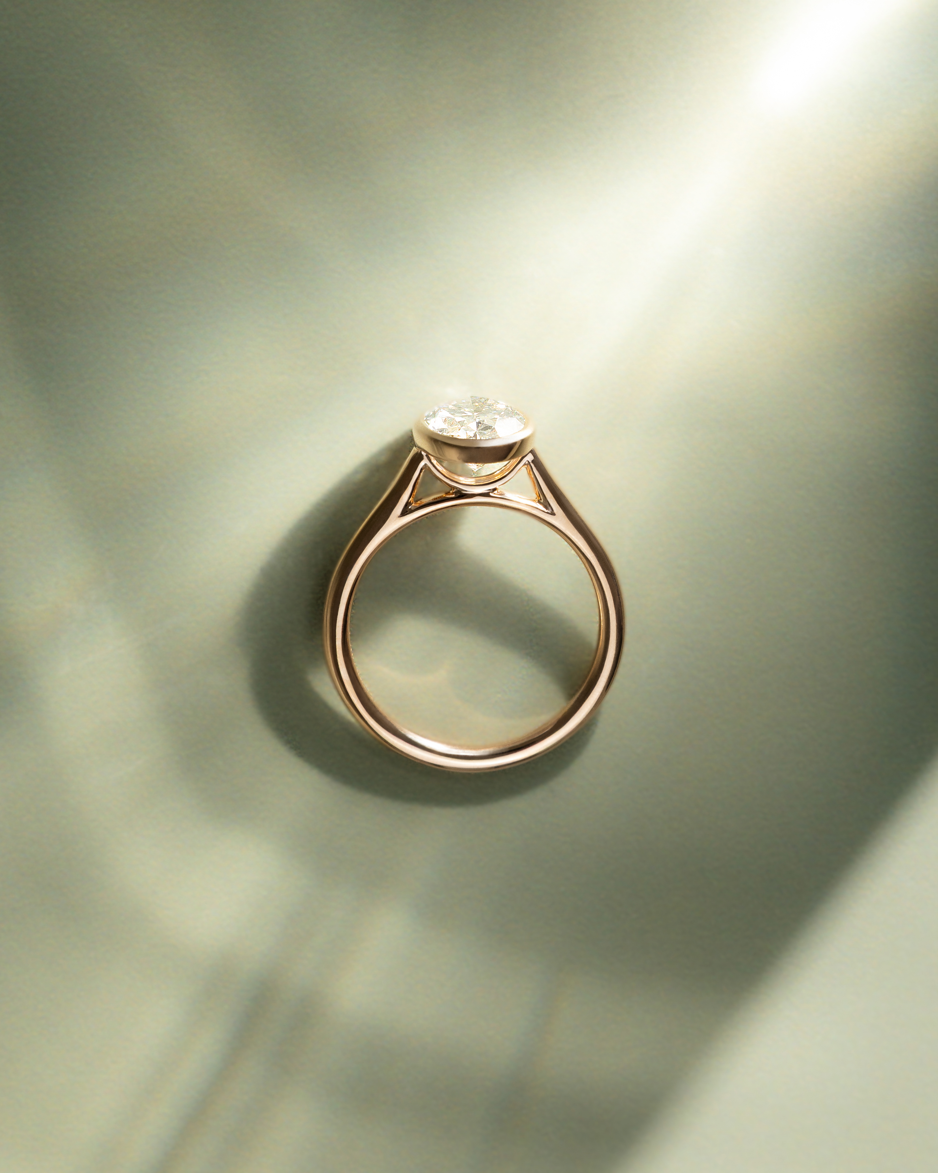 Daphne - Oval Solitaire with Cathedral Bezel Setting Lifestyle Image