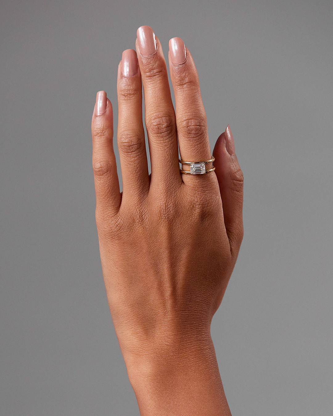 Devon - Emerald Solitaire with Double Band Lifestyle Image