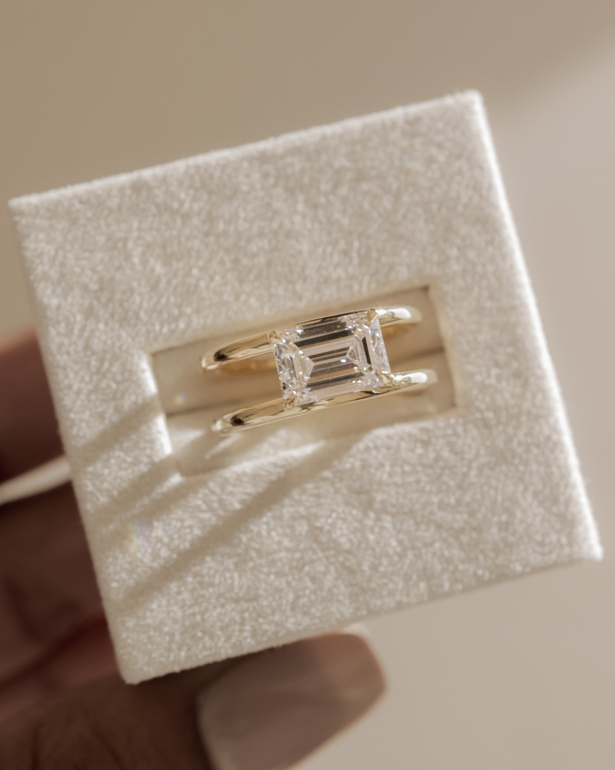 Devon - Emerald Solitaire with Double Band Lifestyle Image