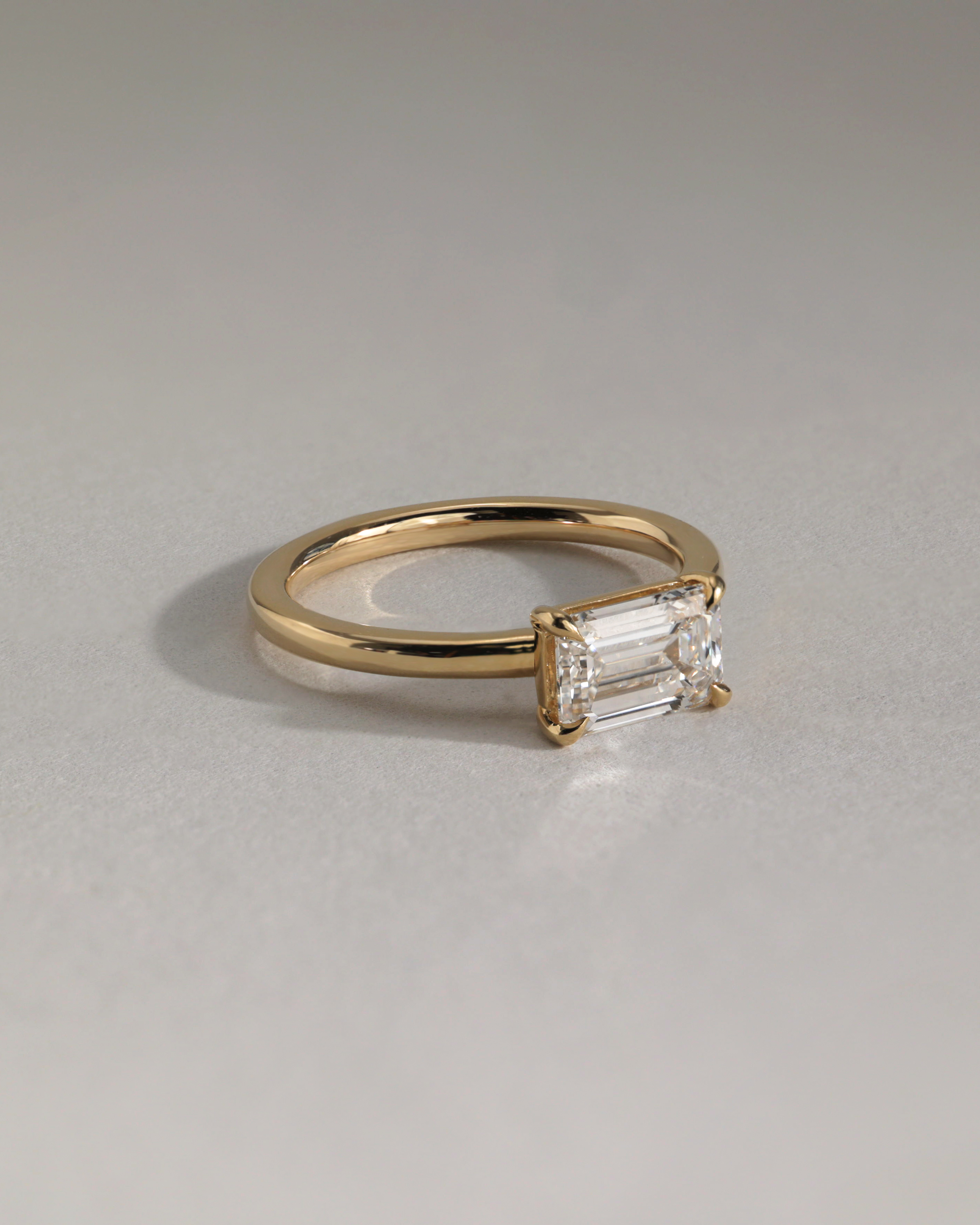 Evelyn  East West Emerald Solitaire Lifestyle Image