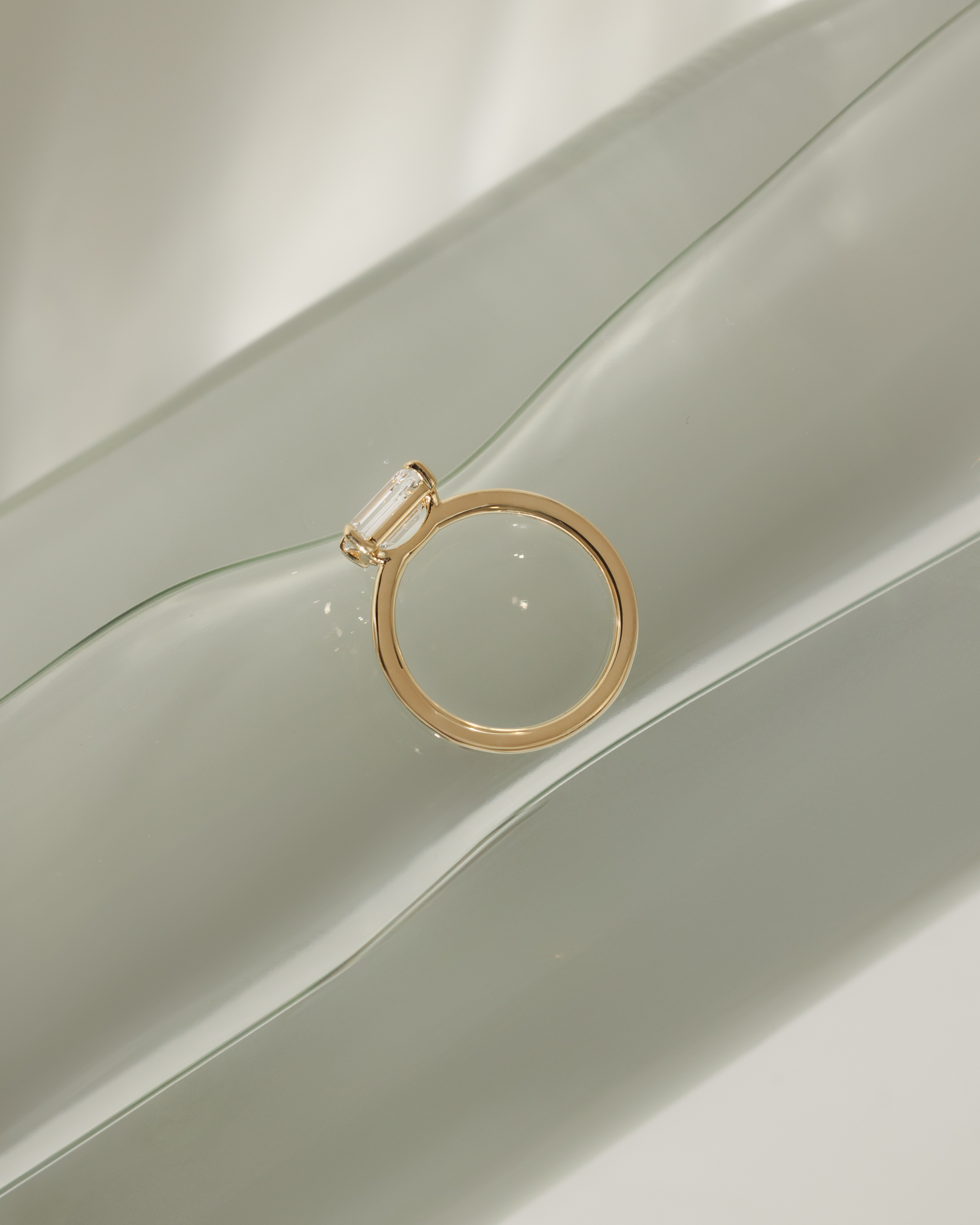 Evelyn  East West Emerald Solitaire Lifestyle Image