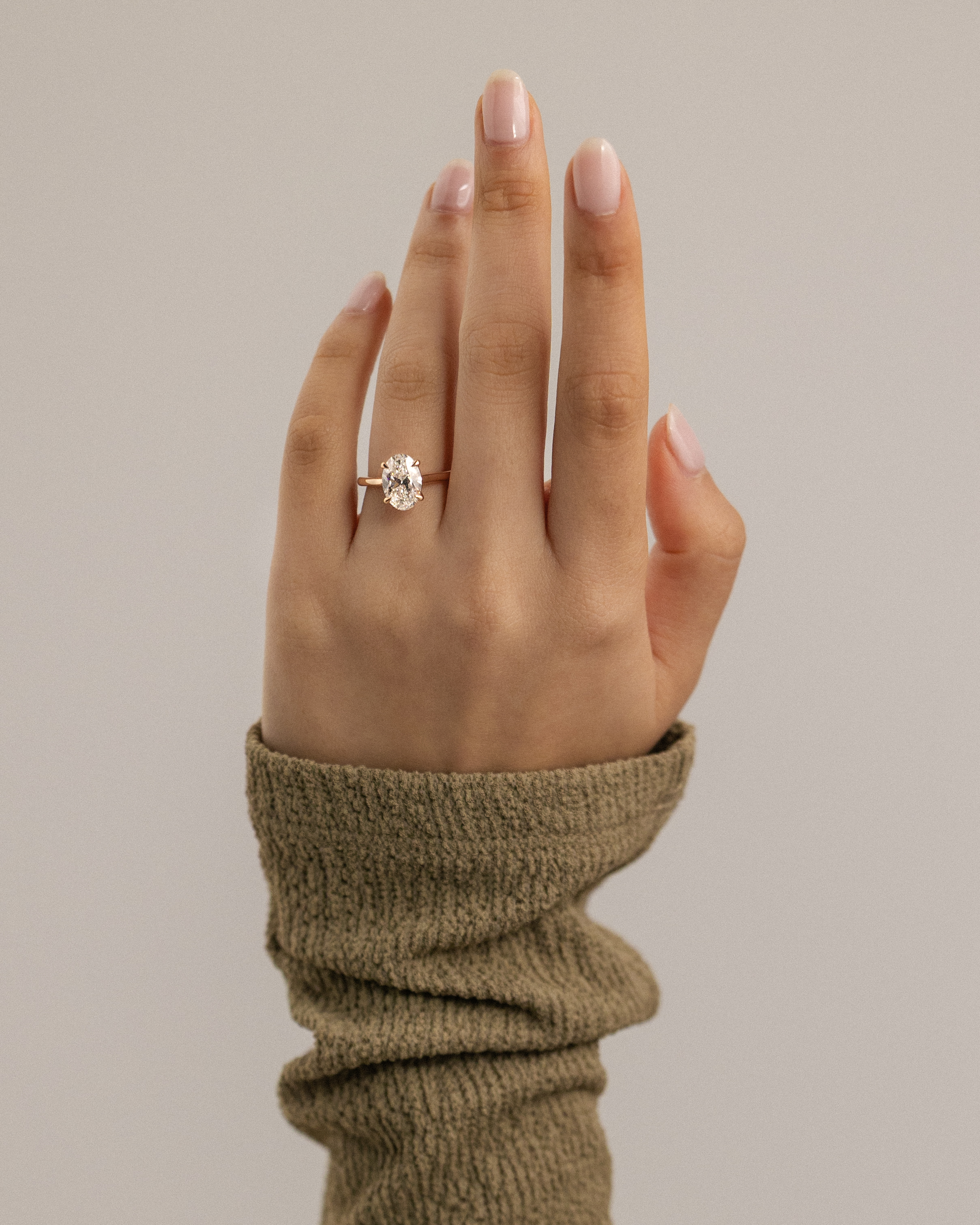 Hilary - 4 Claw Oval Solitaire Lifestyle Image