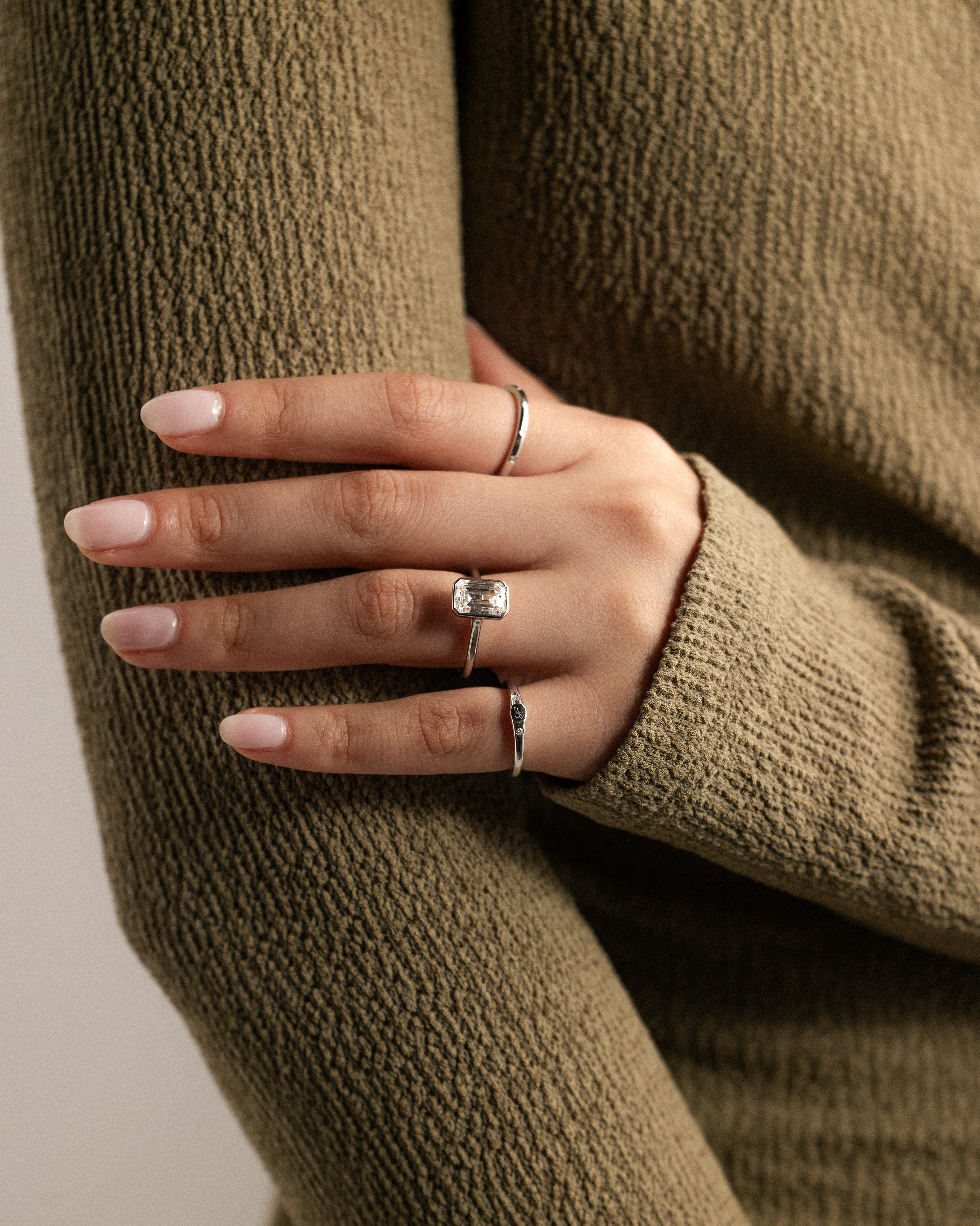 Imani - Bezel Set Emerald Solitaire Lifestyle Image