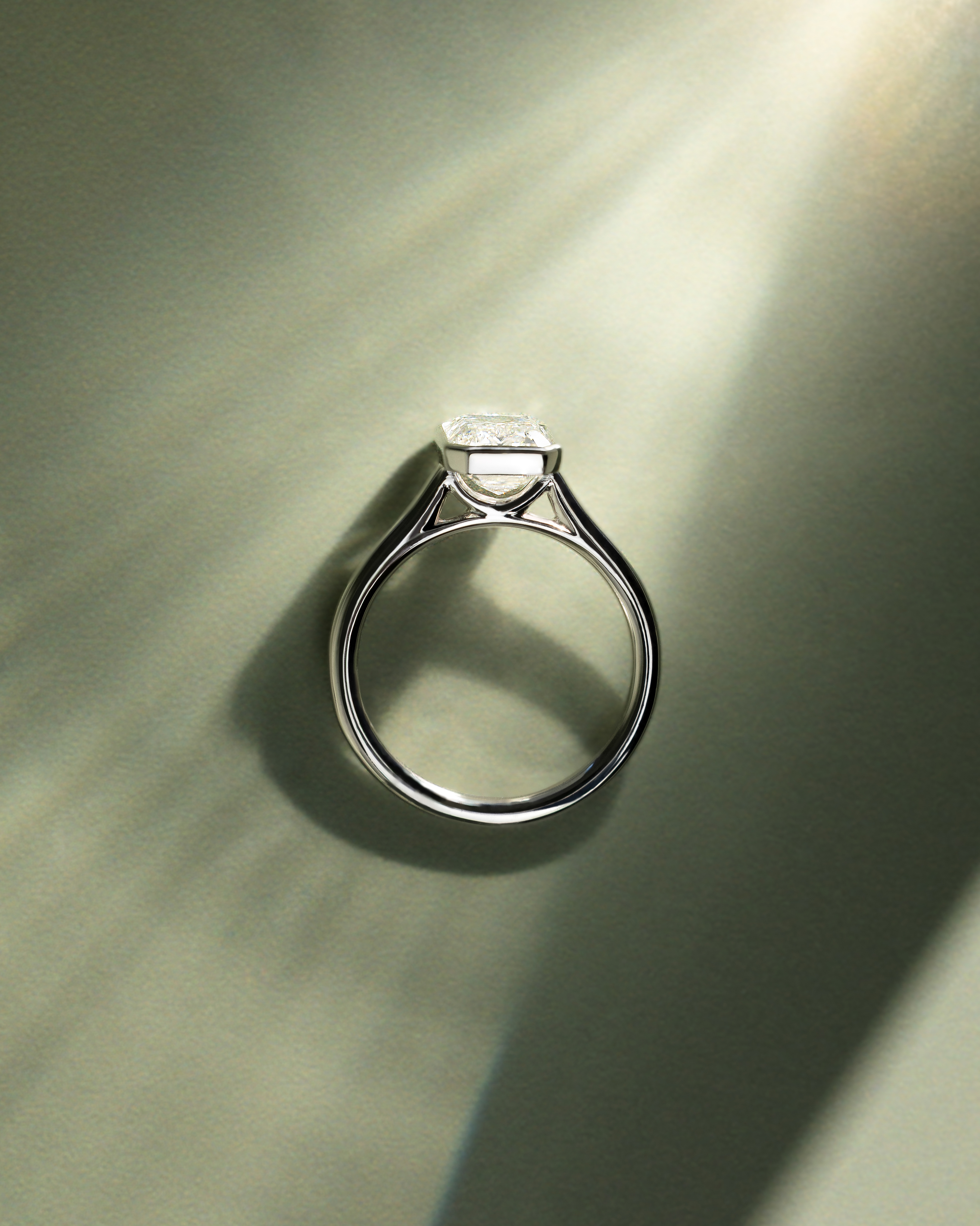 Imani - Bezel Set Emerald Solitaire Lifestyle Image