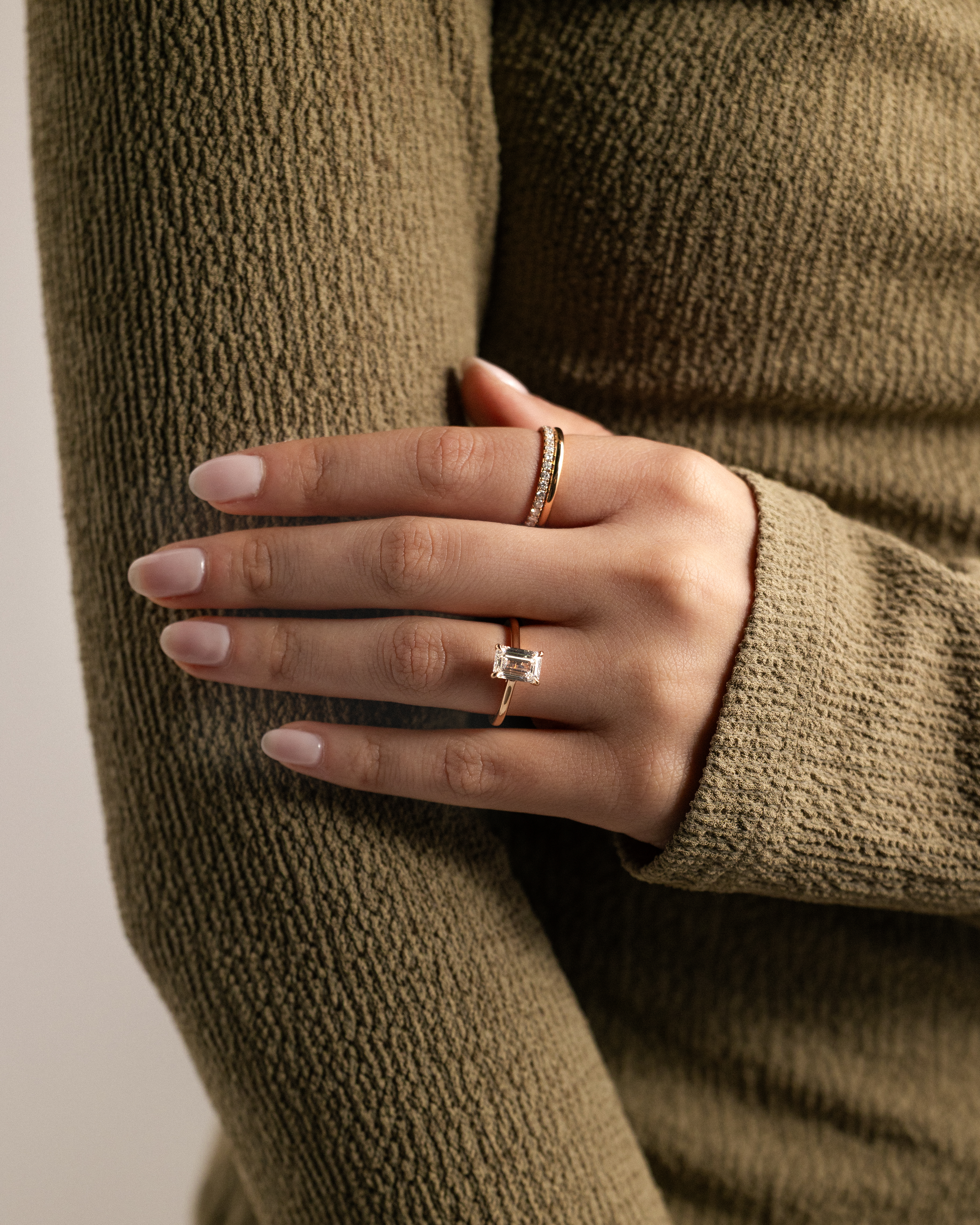 Jane - Emerald Solitaire with Hidden Halo and Cathedral Setting Lifestyle Image