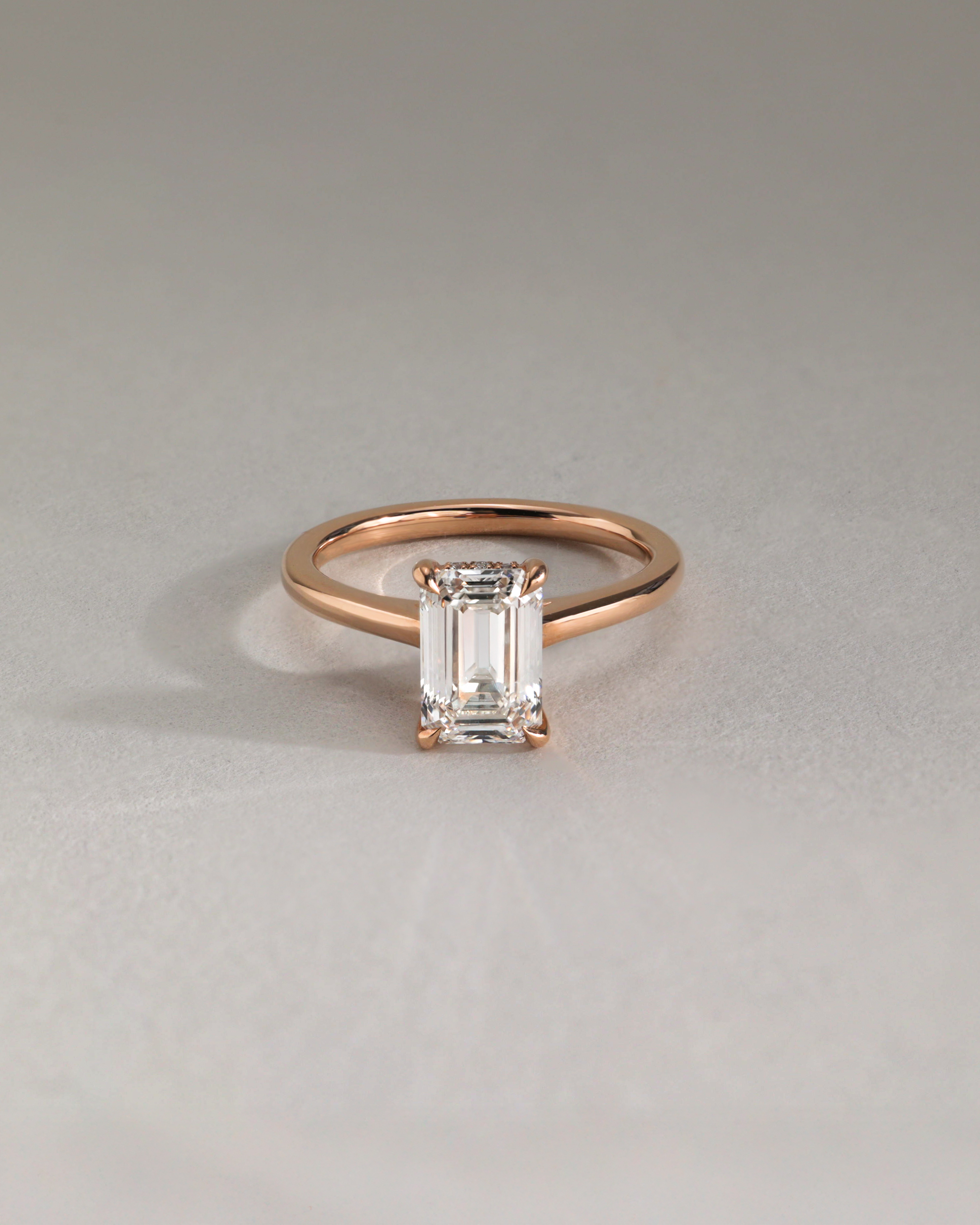 Jane - Emerald Solitaire with Hidden Halo and Cathedral Setting Lifestyle Image