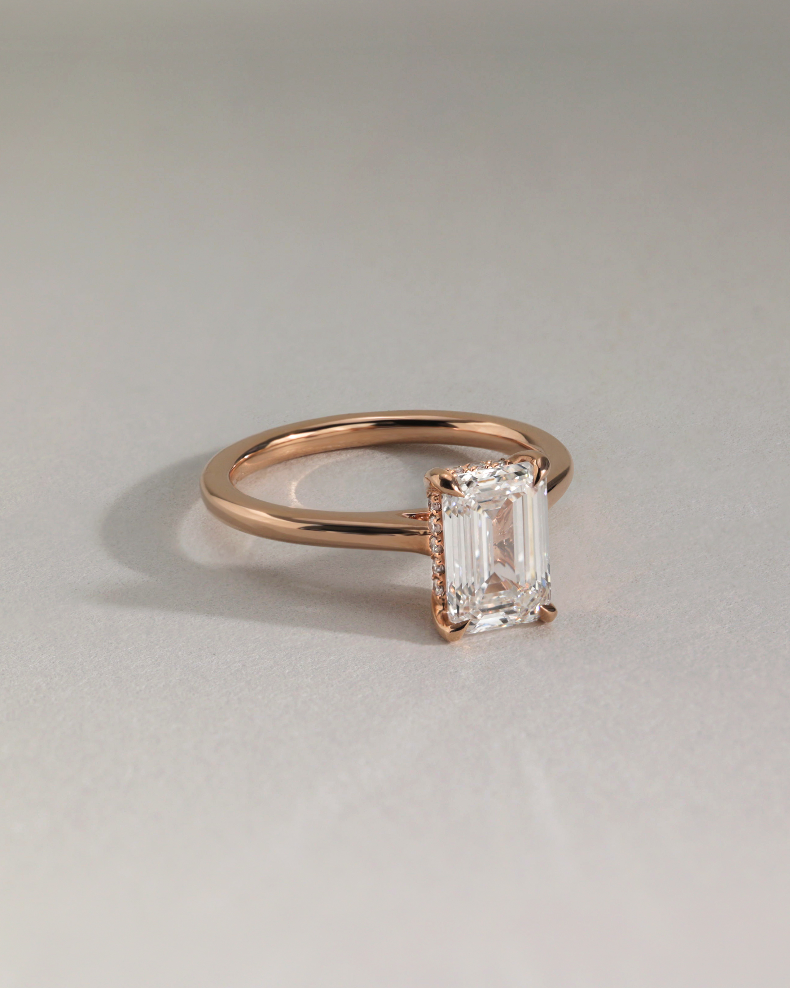 Jane - Emerald Solitaire with Hidden Halo and Cathedral Setting Lifestyle Image