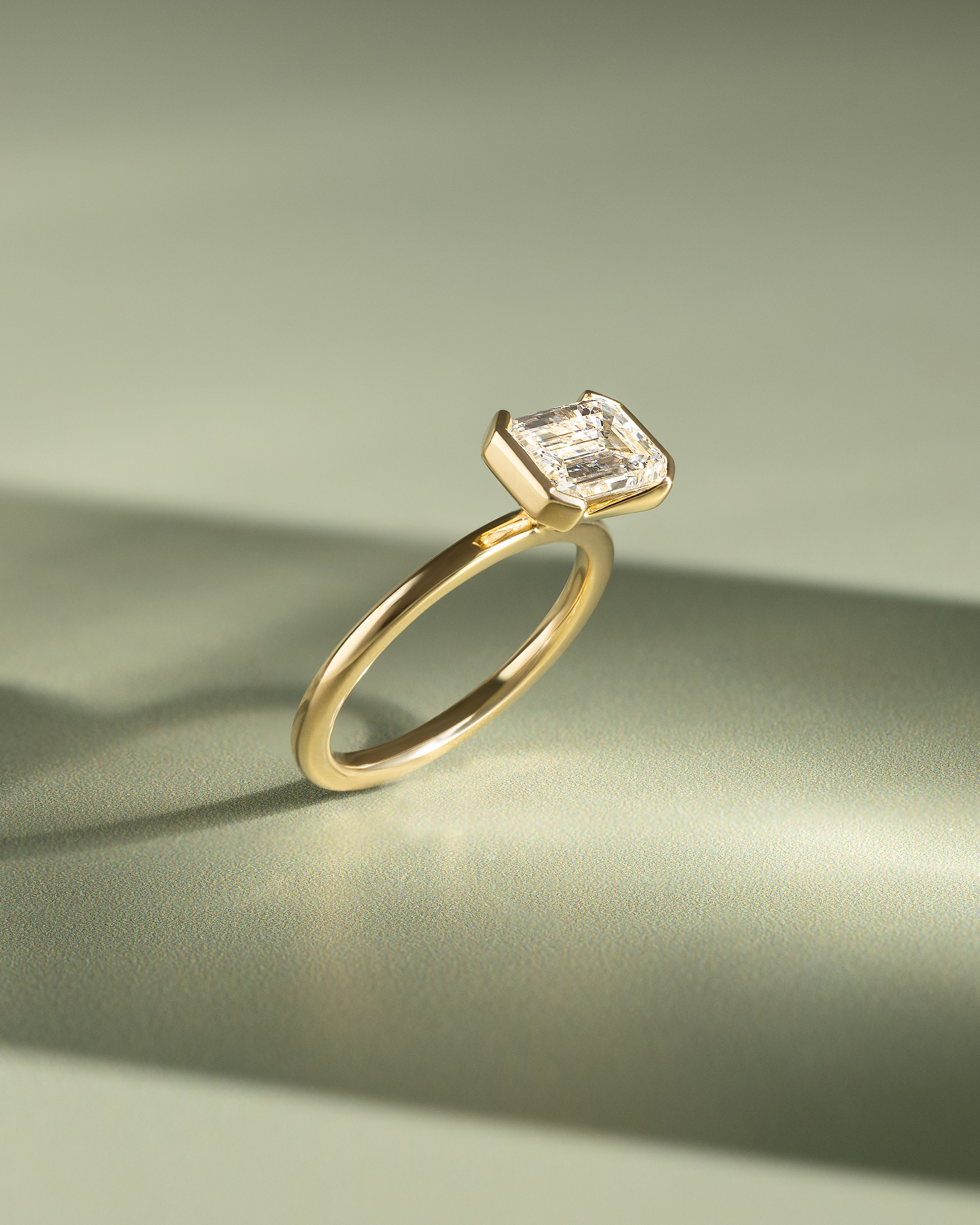 Jodie - Emerald Half Bezel Solitaire Lifestyle Image