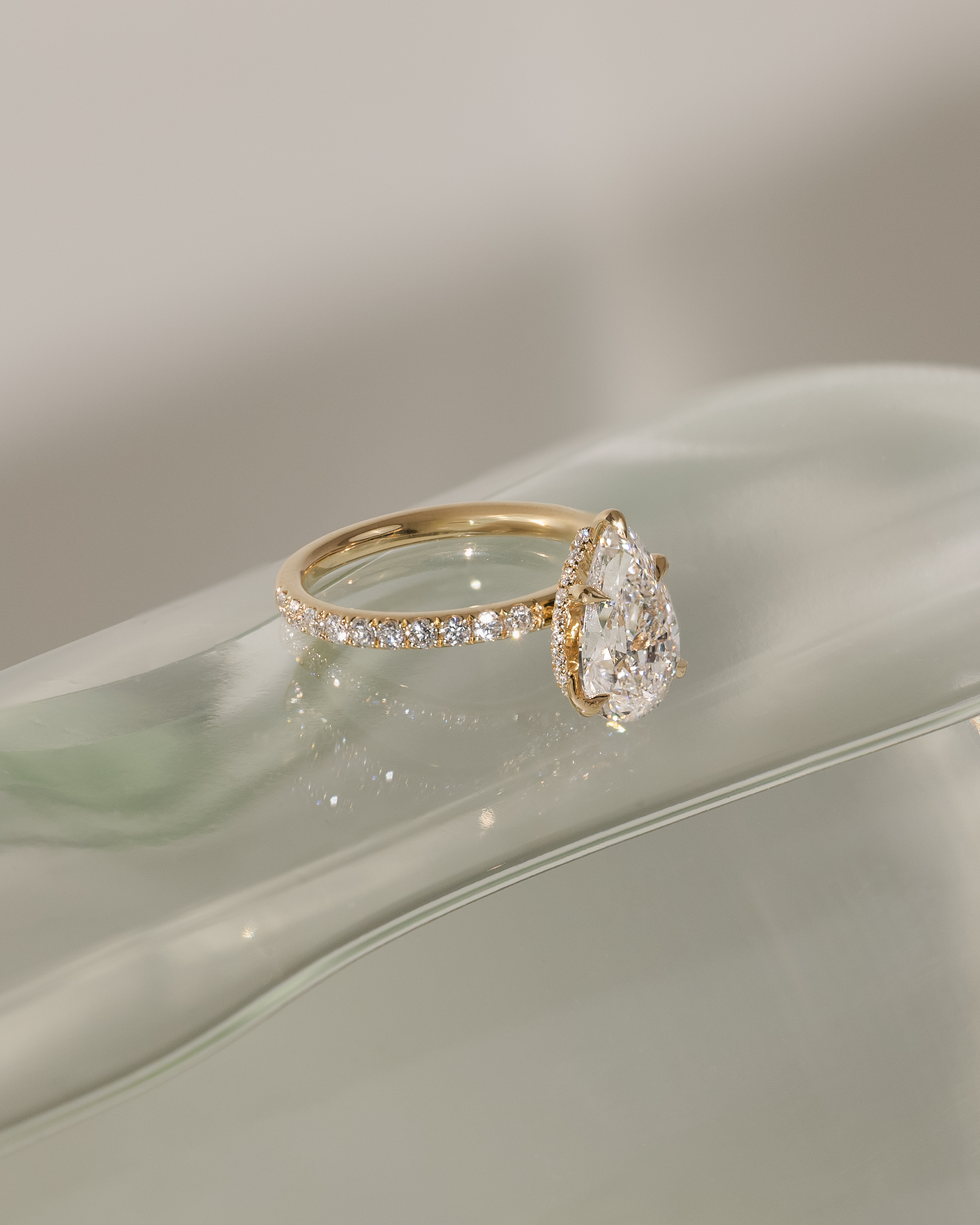 Jordanna  5 Claw Pear Pav Solitaire with Hidden Halo Lifestyle Image