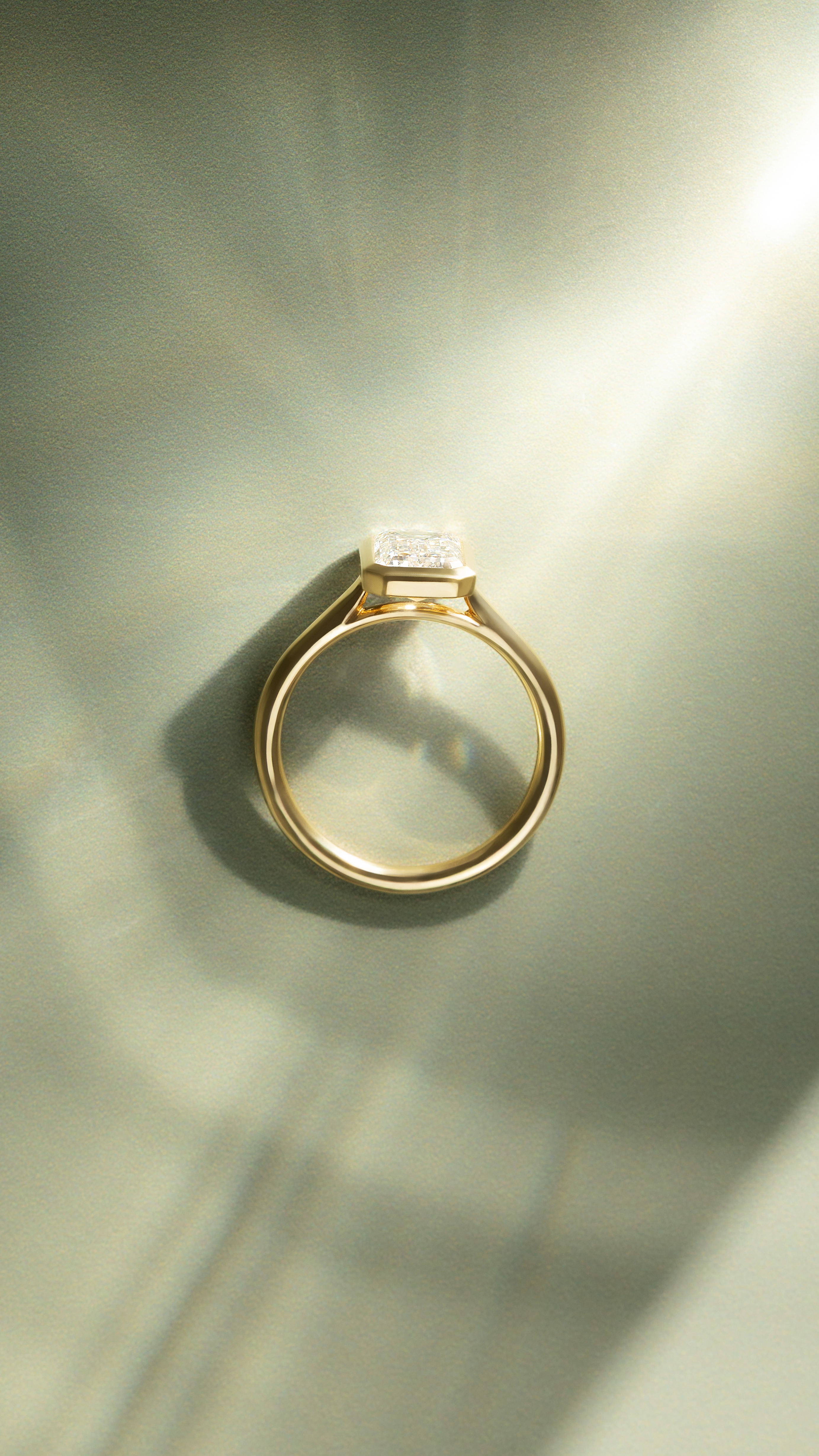 Journee - Bezel Set Emerald Solitaire Lifestyle Image