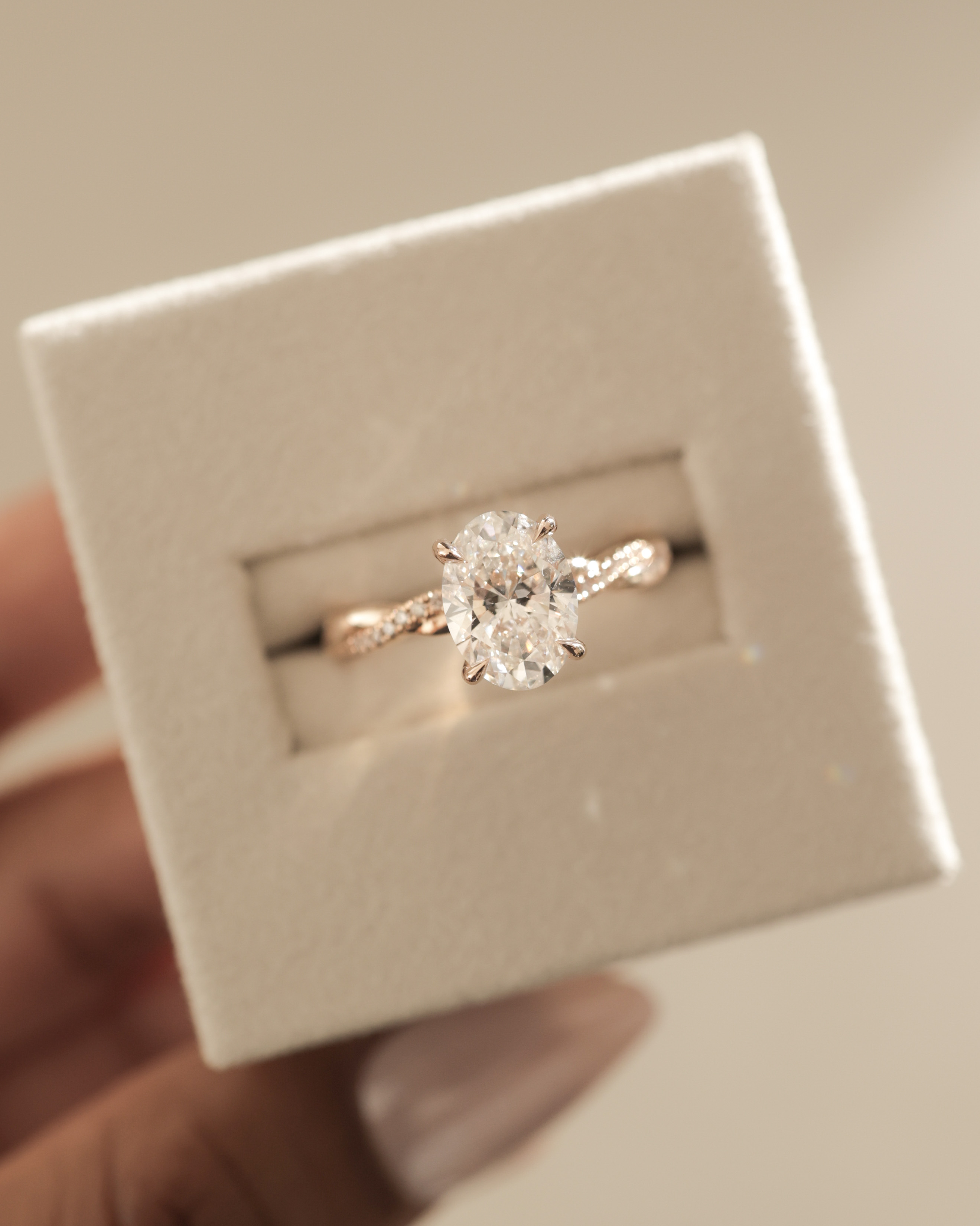 Lara - Oval Solitaire with Twisted Pav Band Lifestyle Image