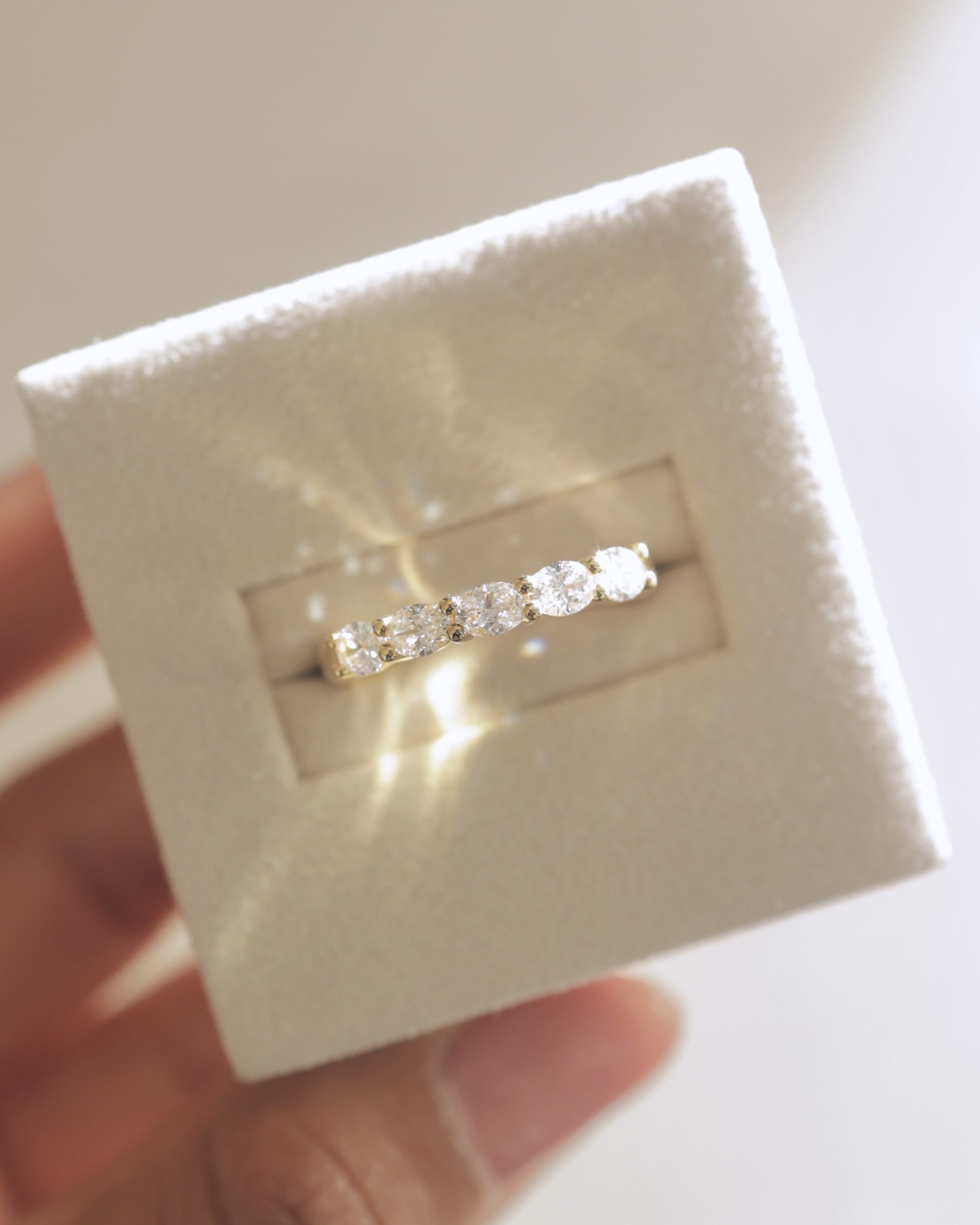 Levi - 5 Stone East West Oval Wedding Band Lifestyle Image