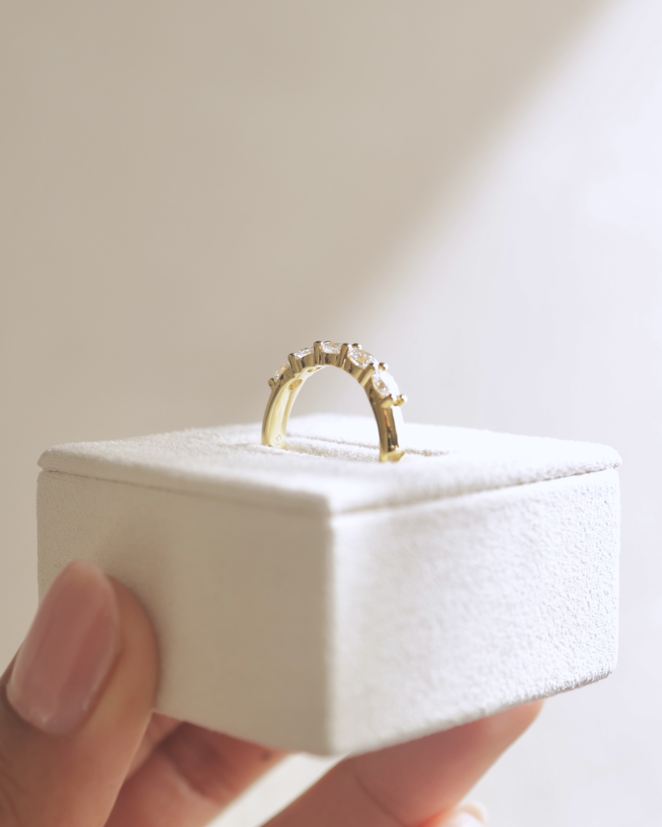 Levi - 5 Stone East West Oval Wedding Band Lifestyle Image