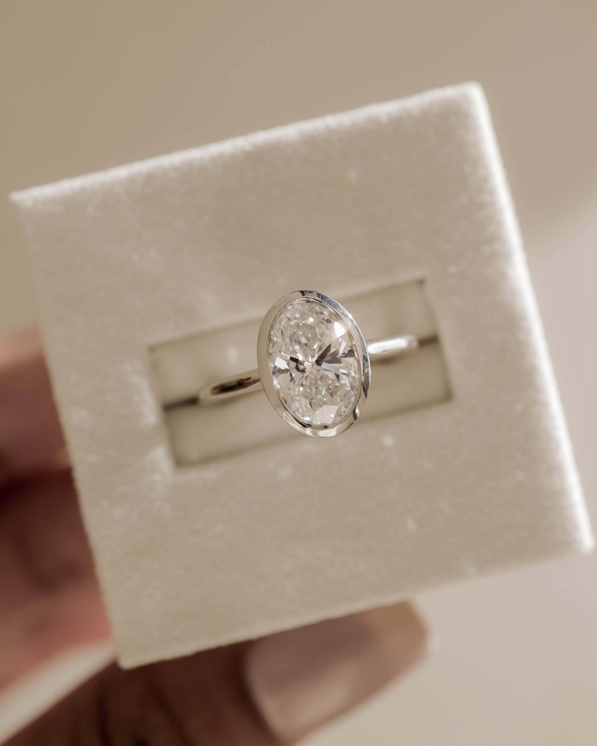 Lexie - Bezel Set Oval with Cathedral Setting Lifestyle Image