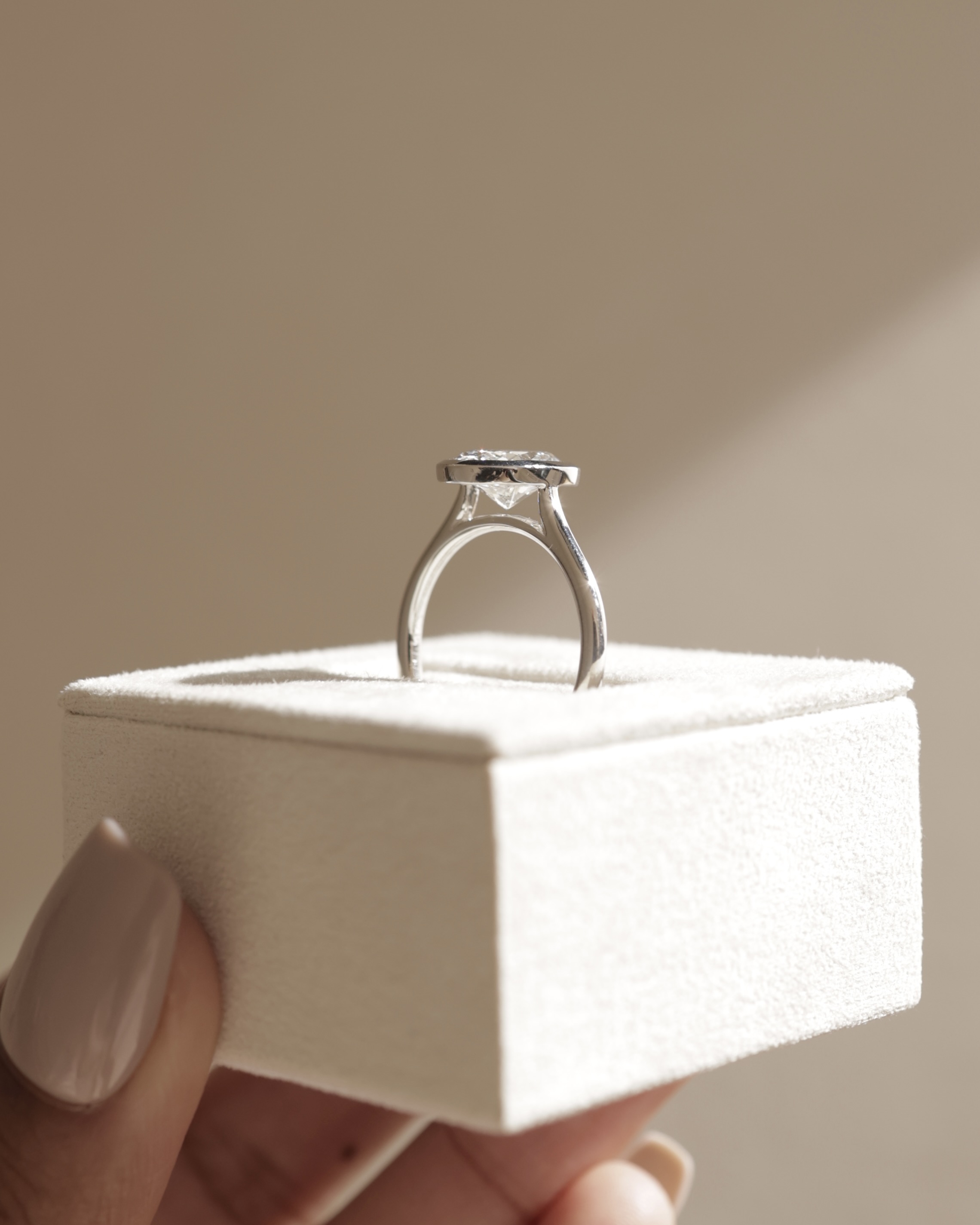 Lexie - Bezel Set Oval with Cathedral Setting Lifestyle Image