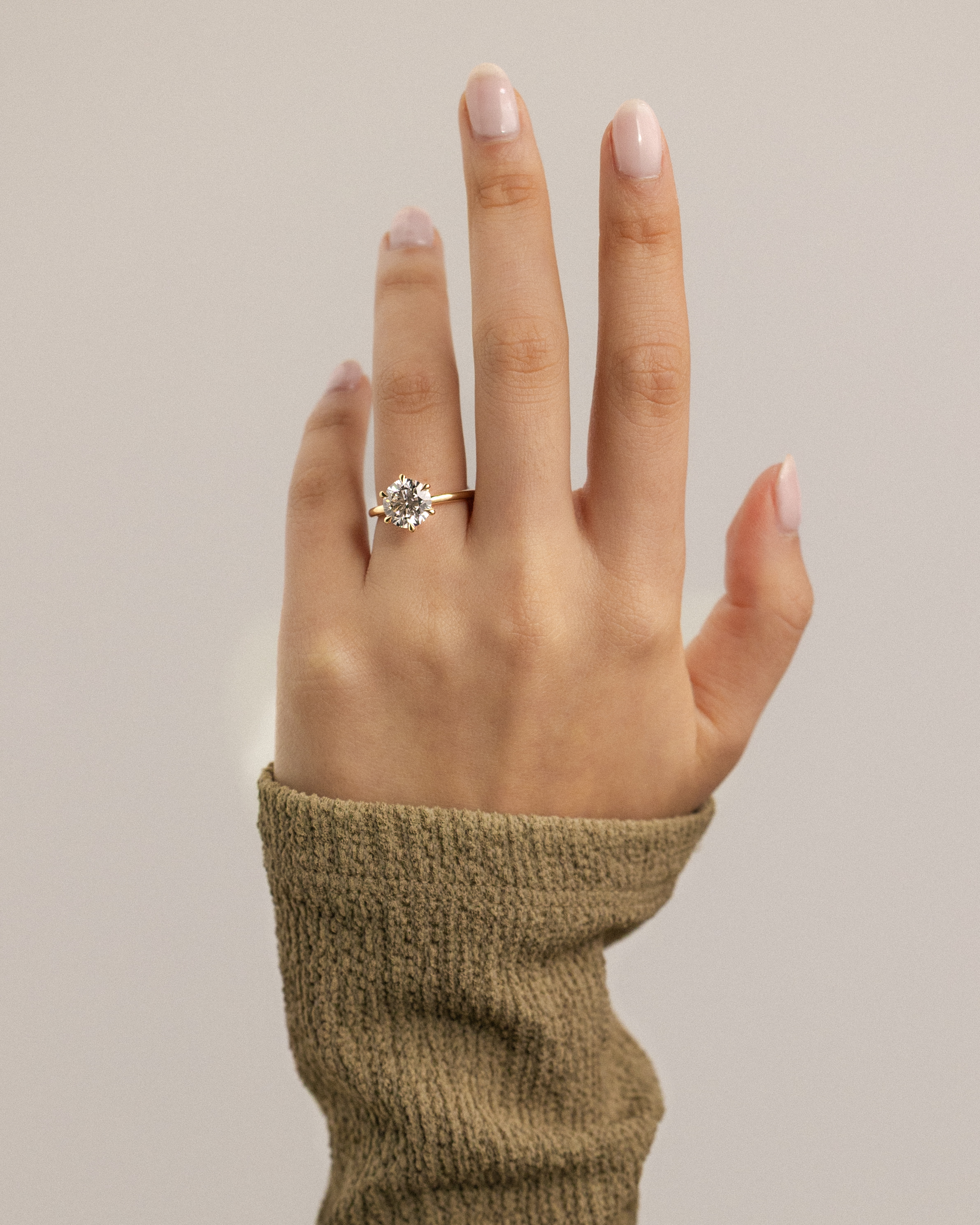 Louise  6 Claw Round Solitaire Lifestyle Image