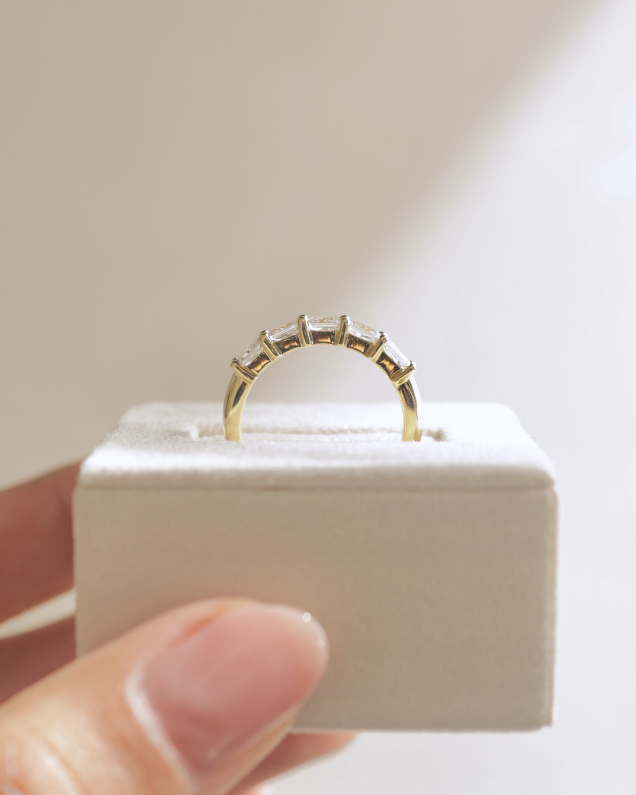 Maia - 5 Stone East West Radiant Wedding Band Lifestyle Image