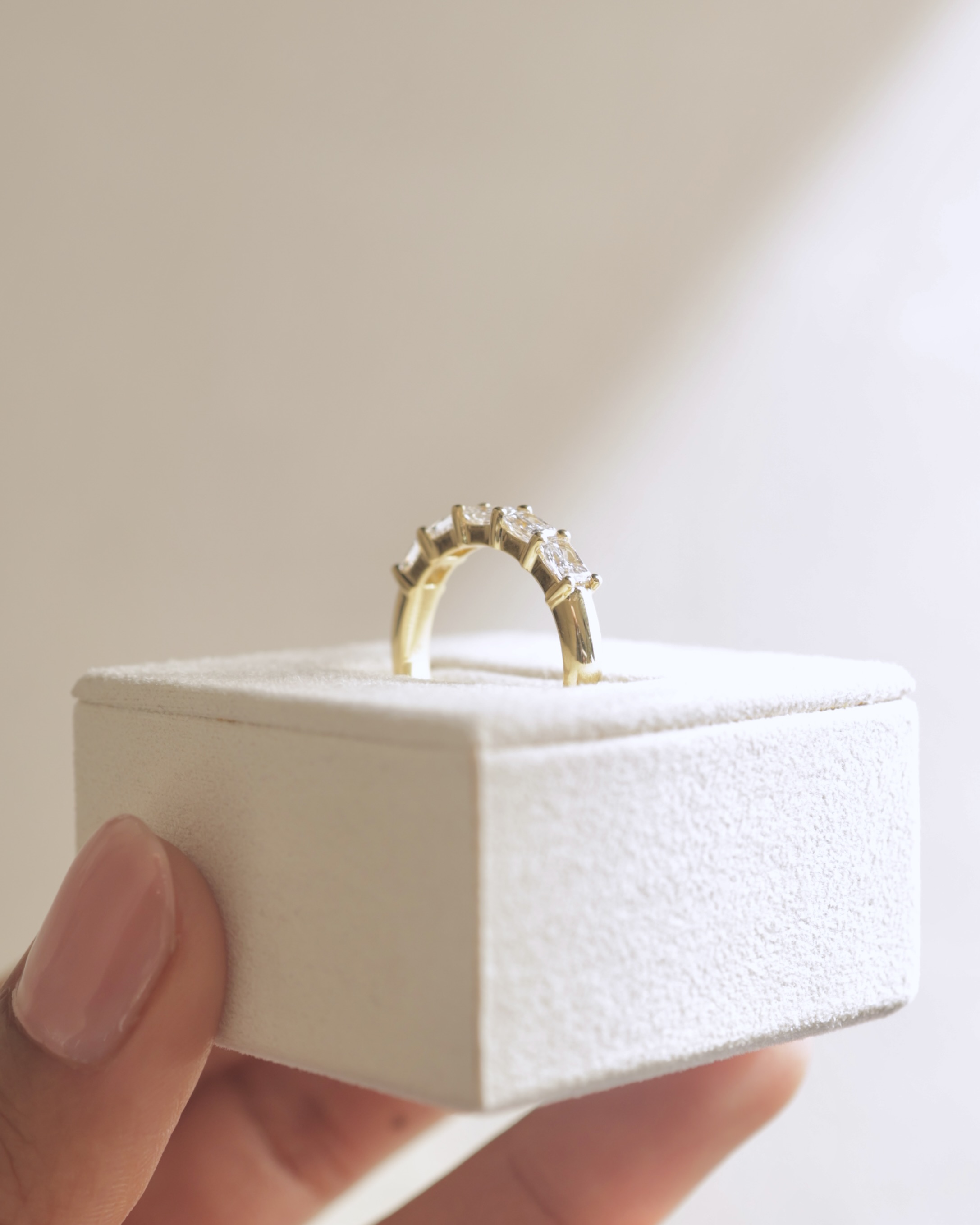 Maia - 5 Stone East West Radiant Wedding Band Lifestyle Image