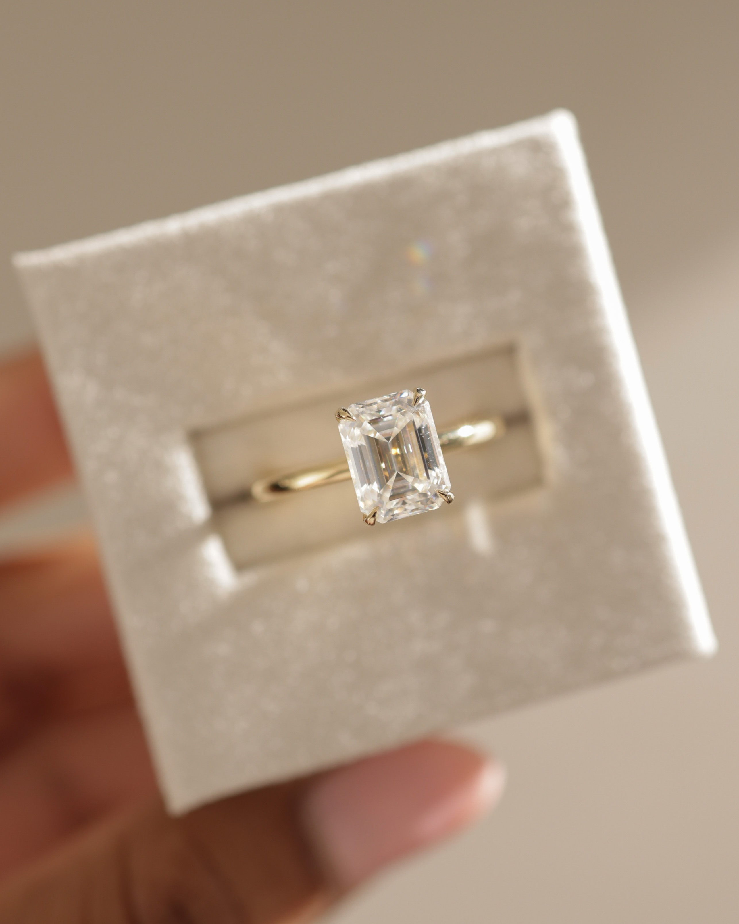 Miller - Emerald Solitaire with Hidden Halo Lifestyle Image