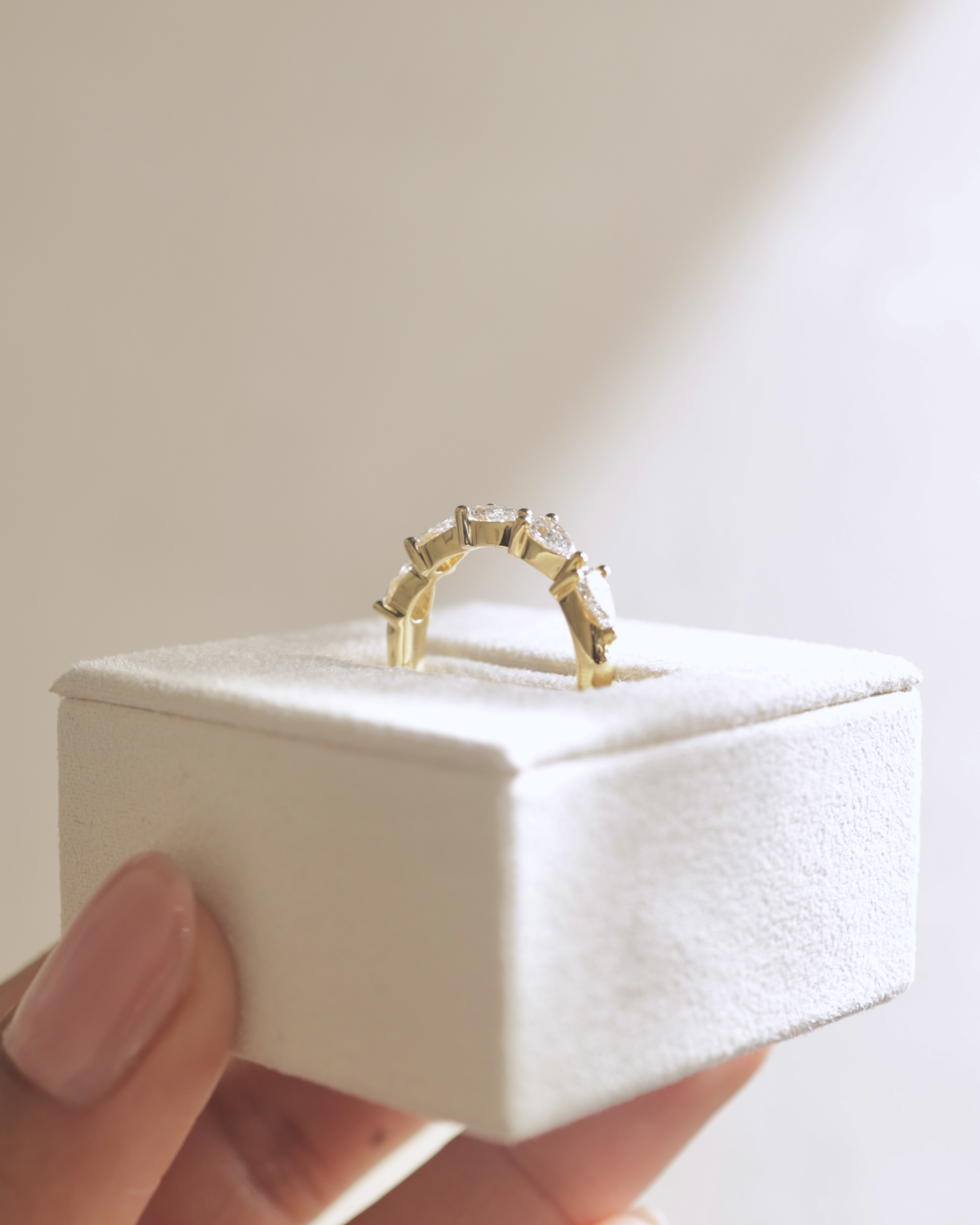 Narissa - 5 Stone East West Pear Wedding Band Lifestyle Image