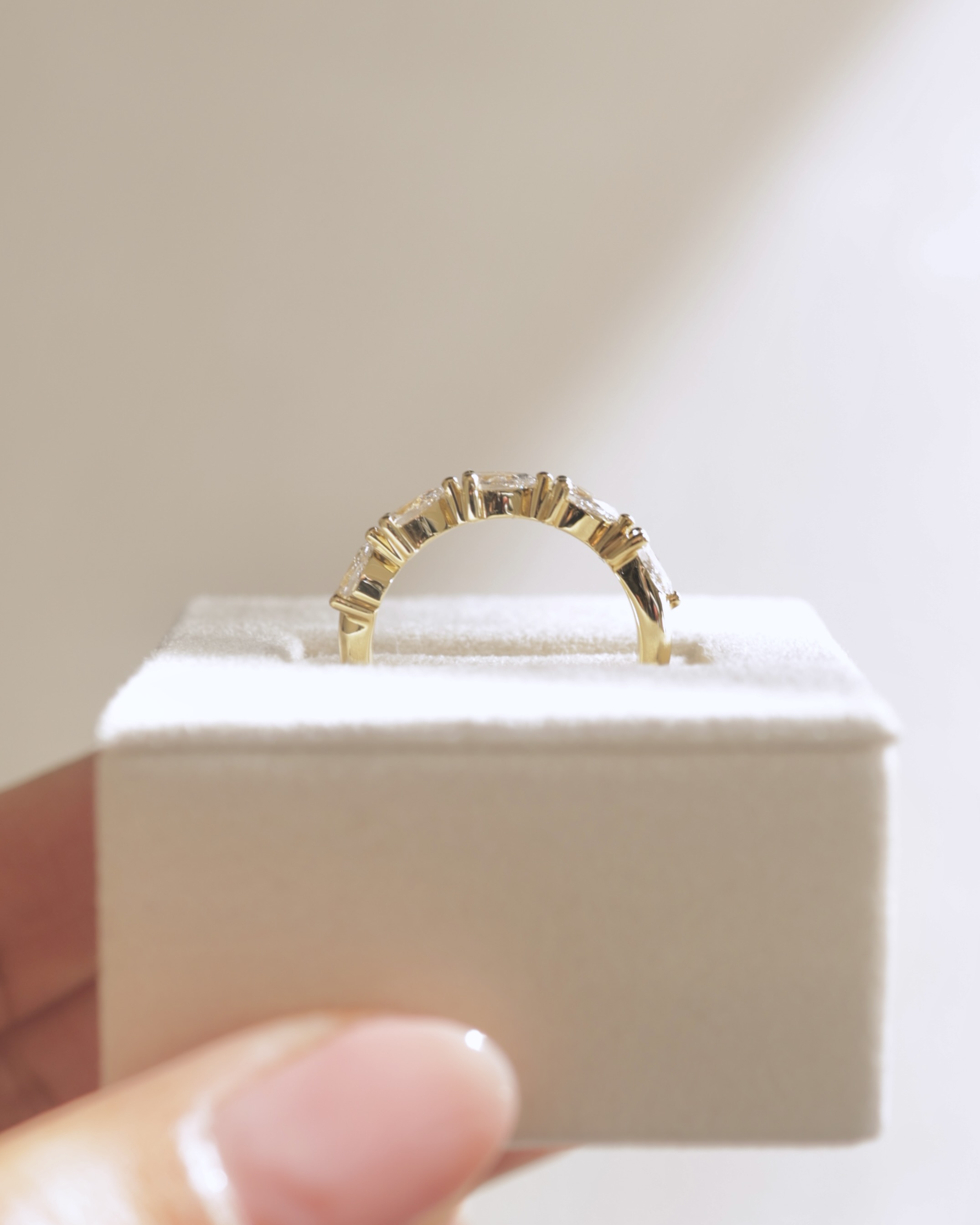 Narissa - 5 Stone East West Pear Wedding Band Lifestyle Image