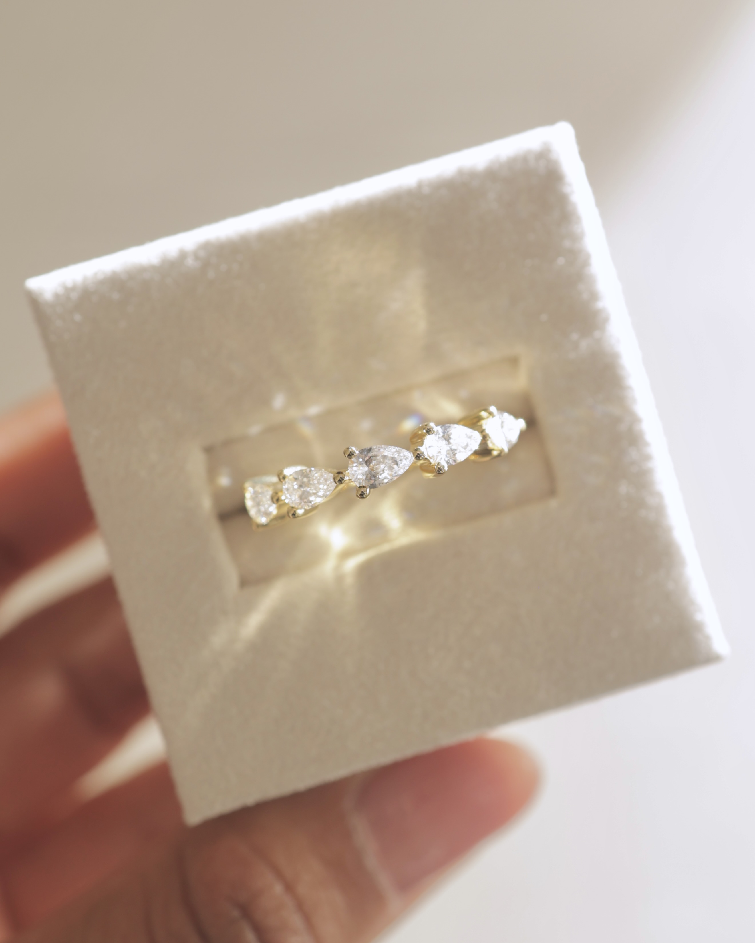 Narissa - 5 Stone East West Pear Wedding Band Lifestyle Image